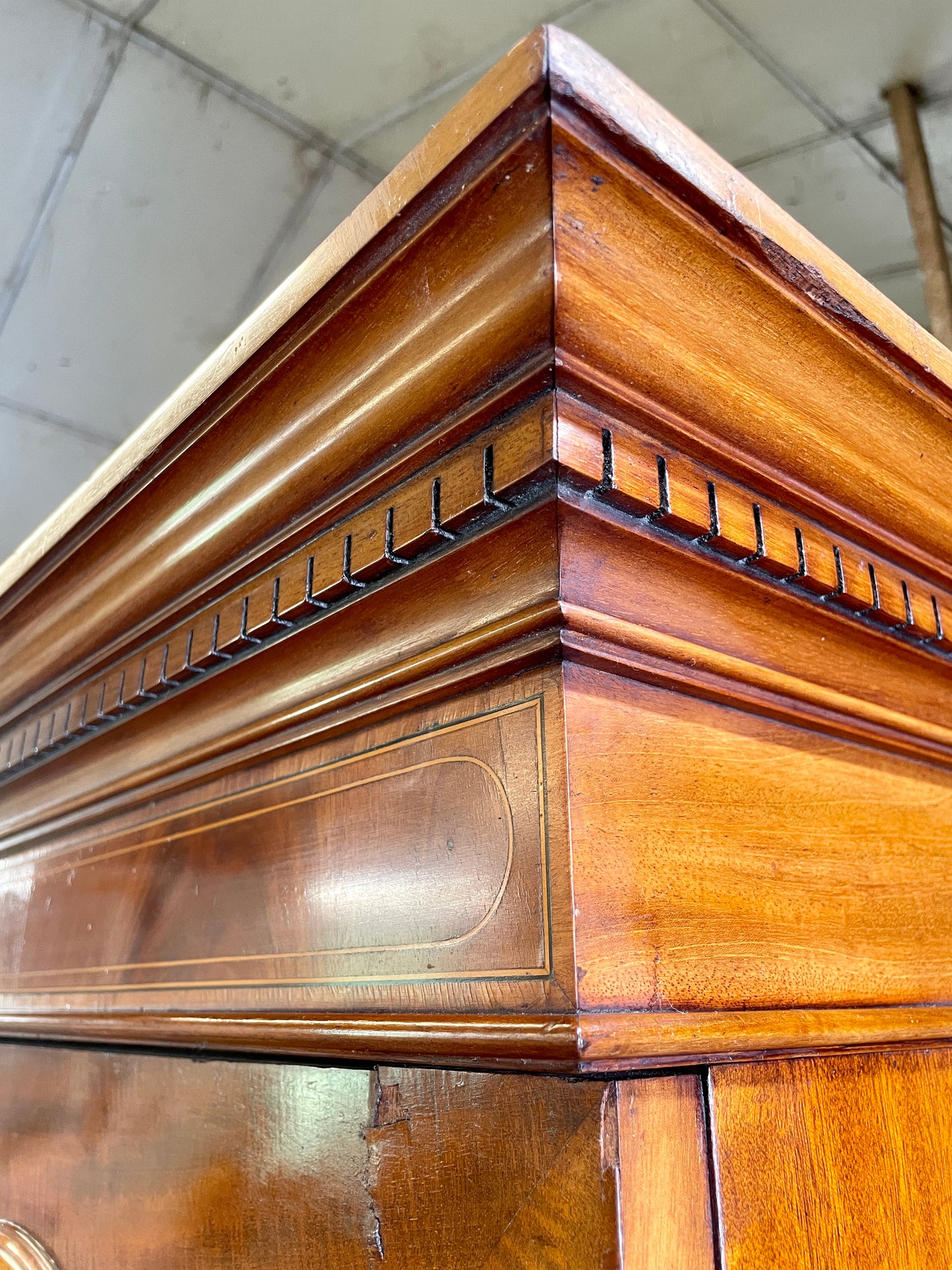Close-up of a wooden cabinet with intricate detailing