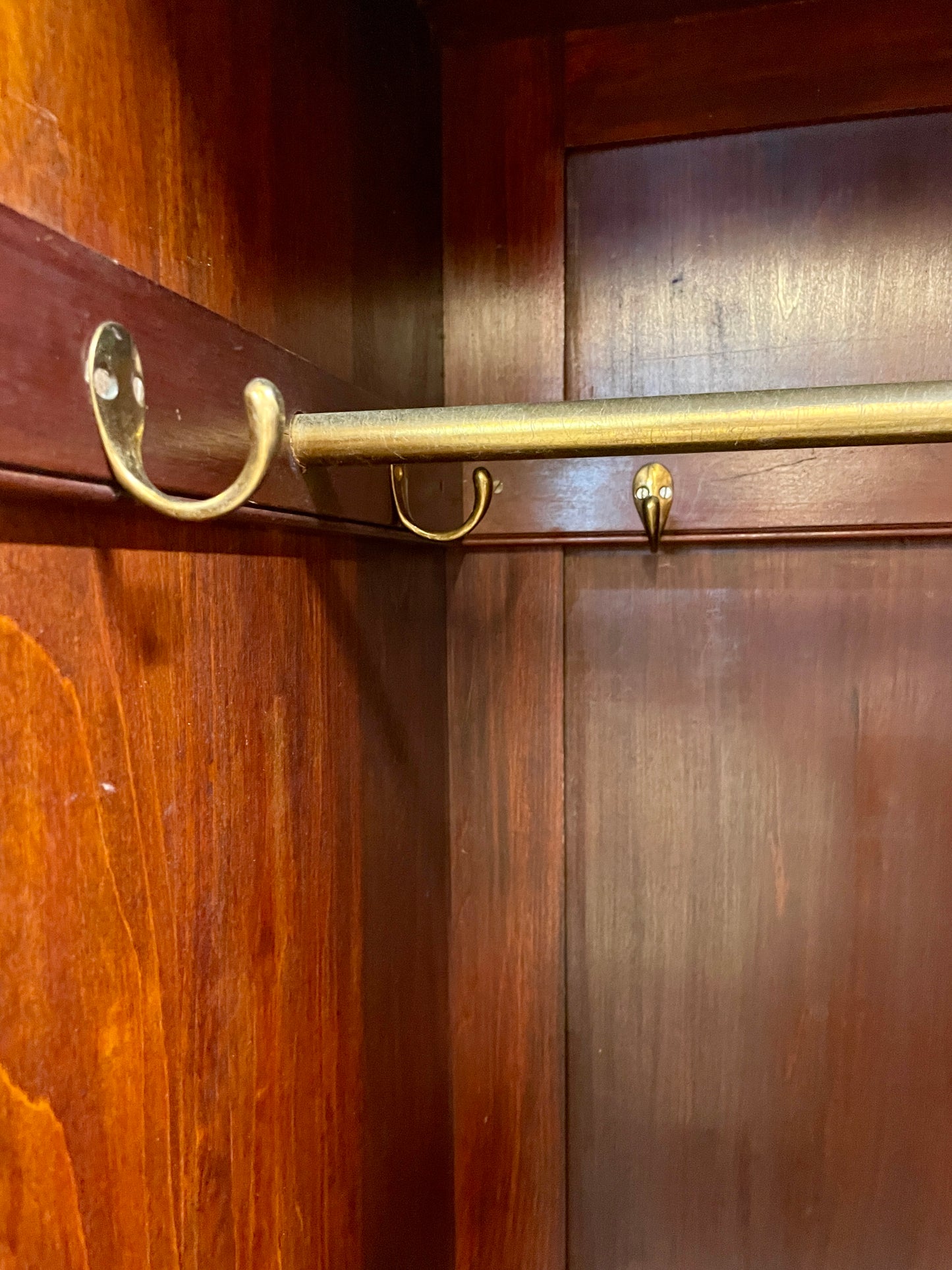 Wooden wardrobe with brass handles