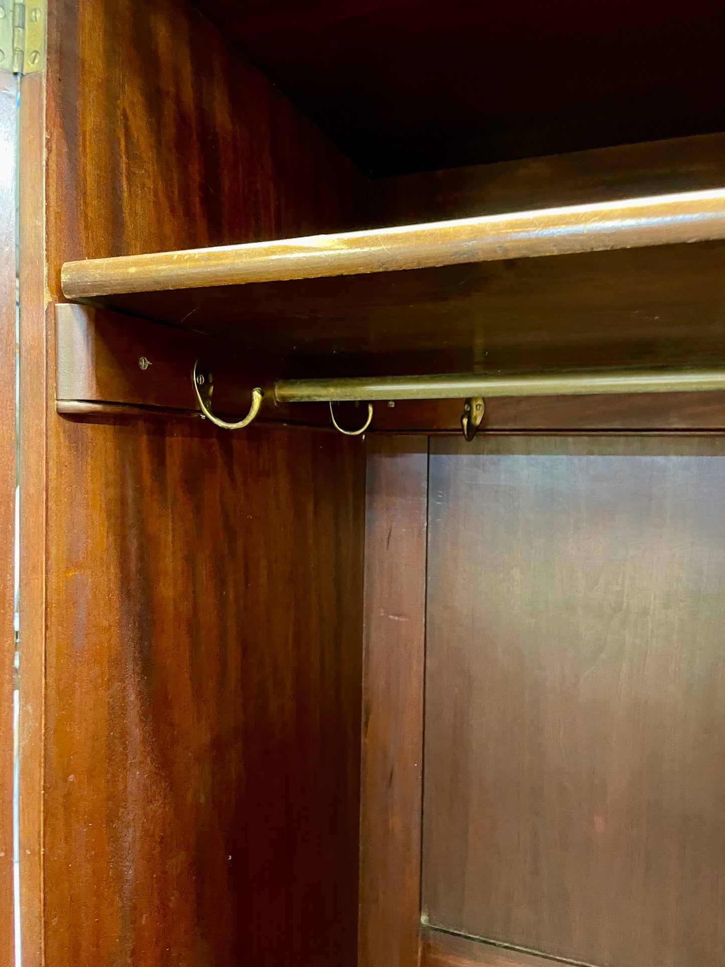 Wooden wardrobe with a brass handle