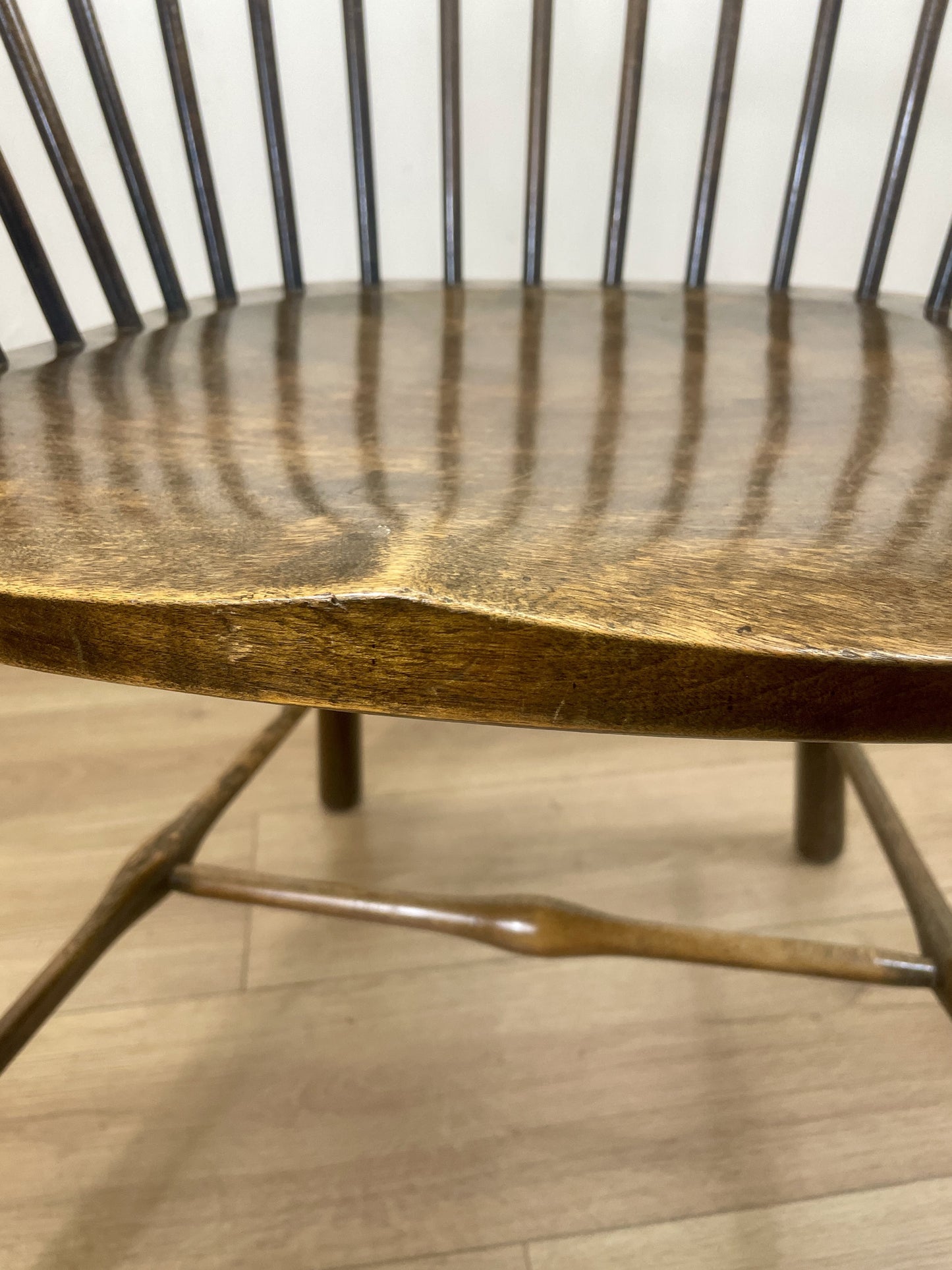 Wooden chair with a worn surface on a wooden floor