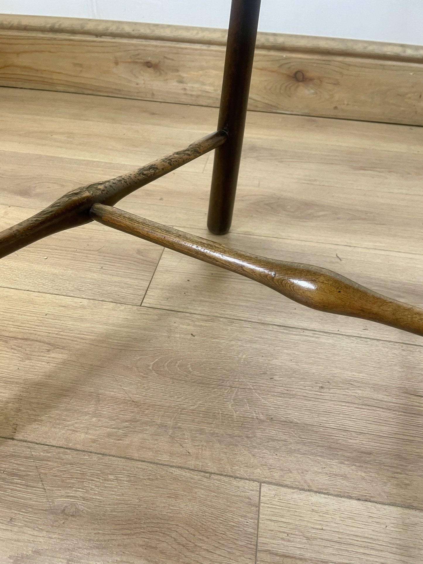 Wooden chair leg on a wooden floor
