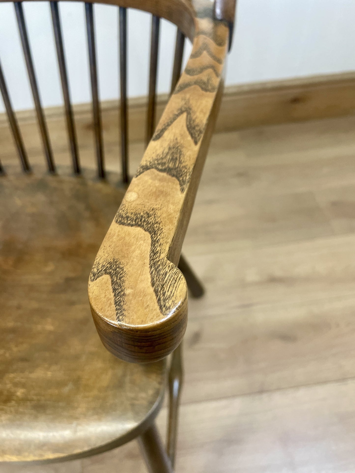 Wooden chair with a detailed carvings on a wooden floor