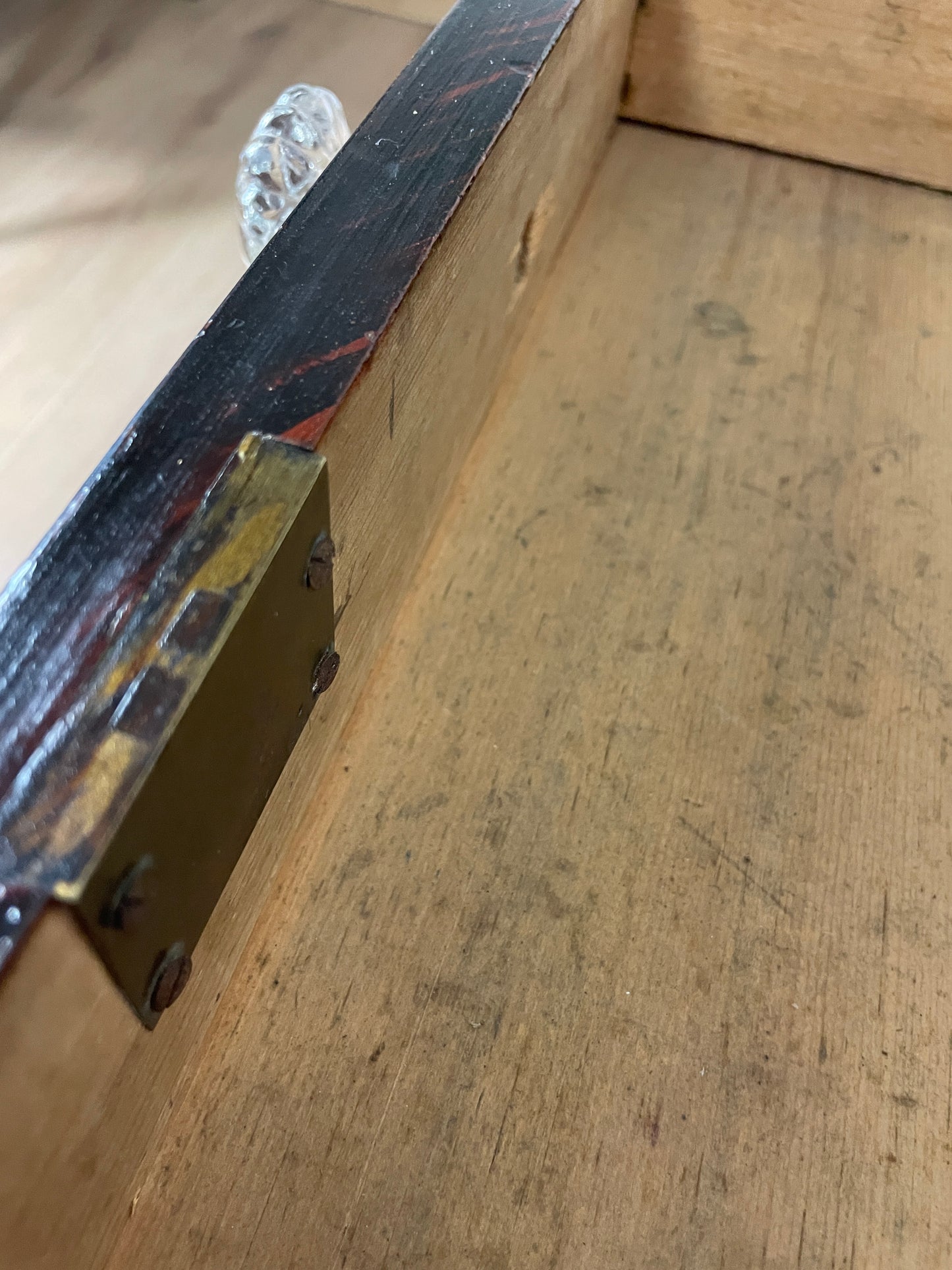 Metal bracket on a wooden surface