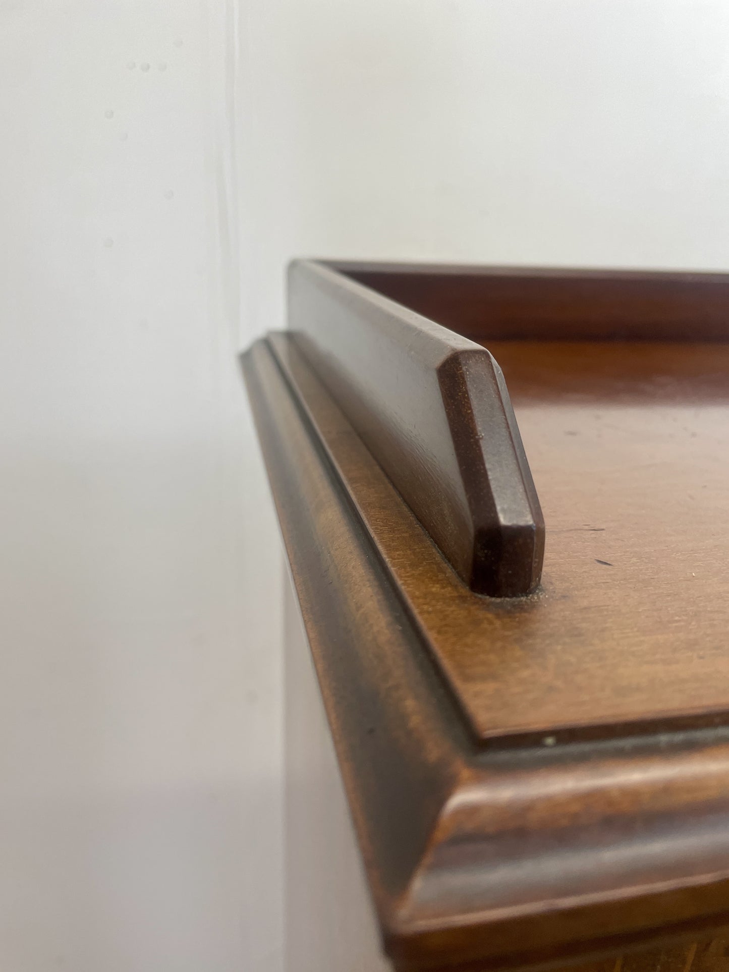 Wooden tray with a handle on a white background