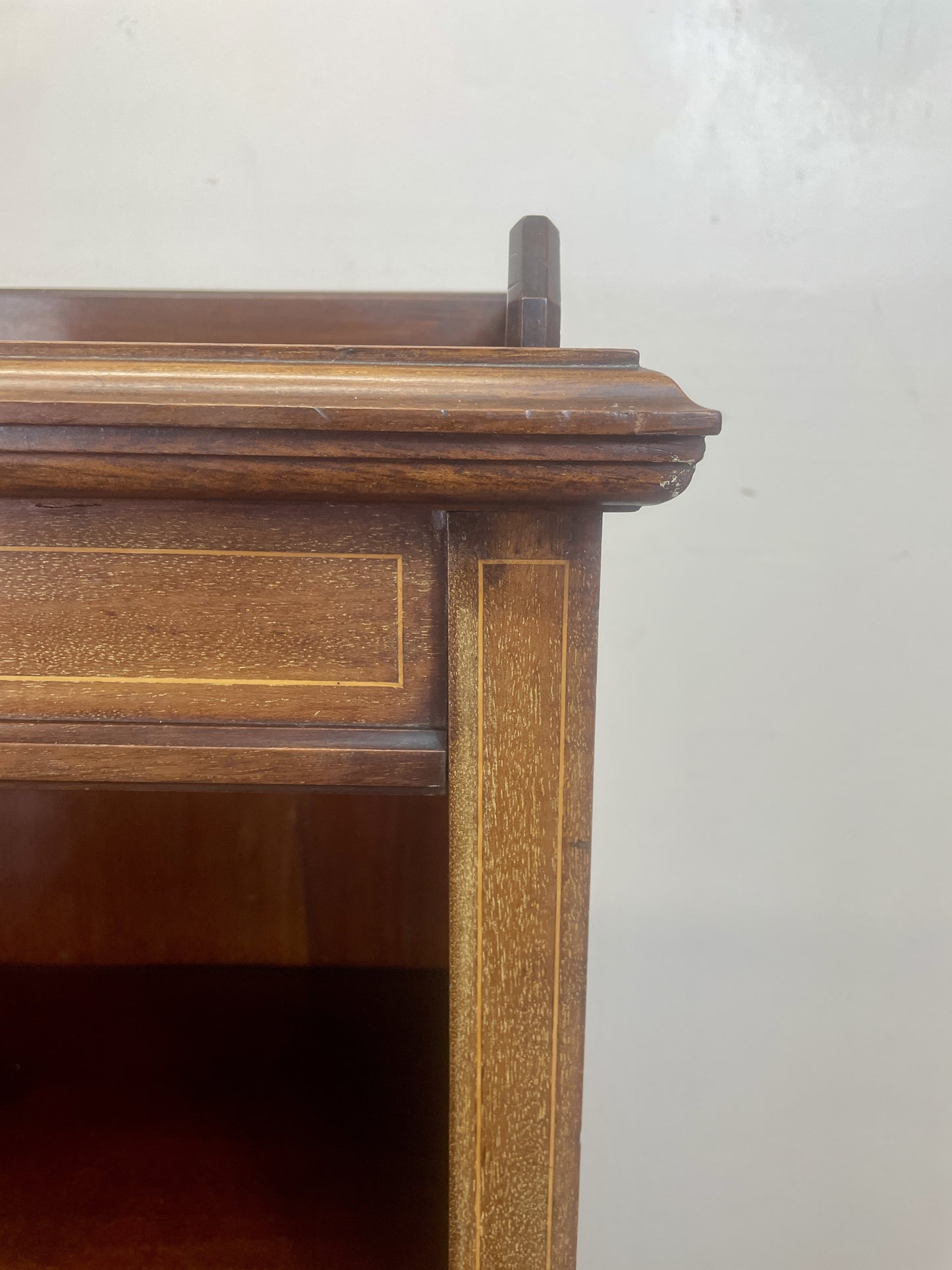 Wooden shelf with a plain background