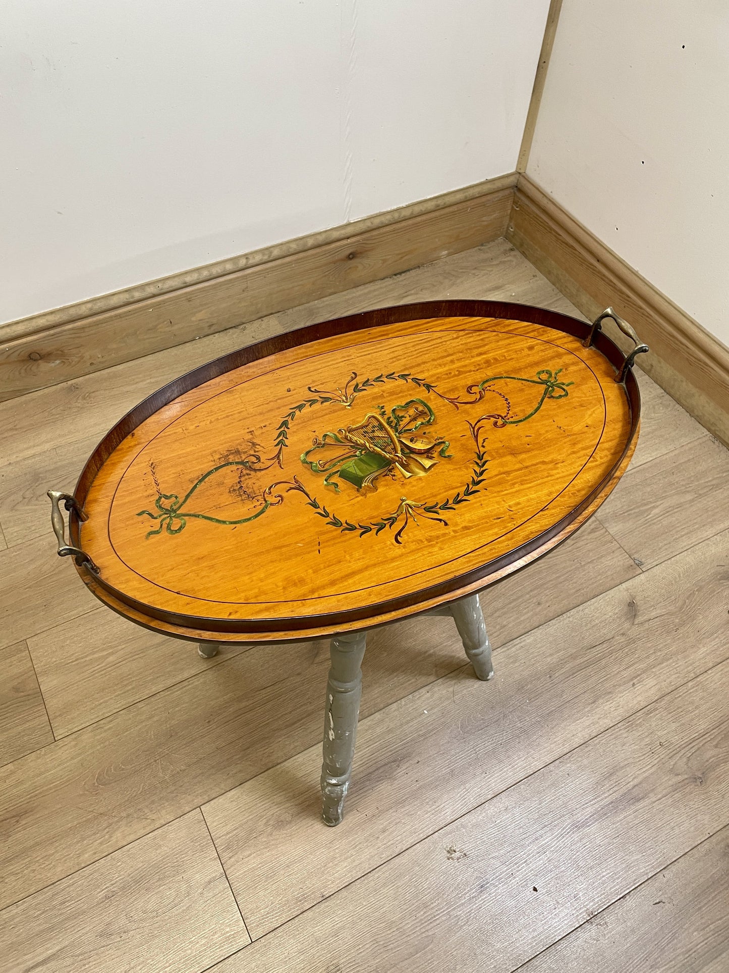 Wooden table with decorative design on a wooden floor