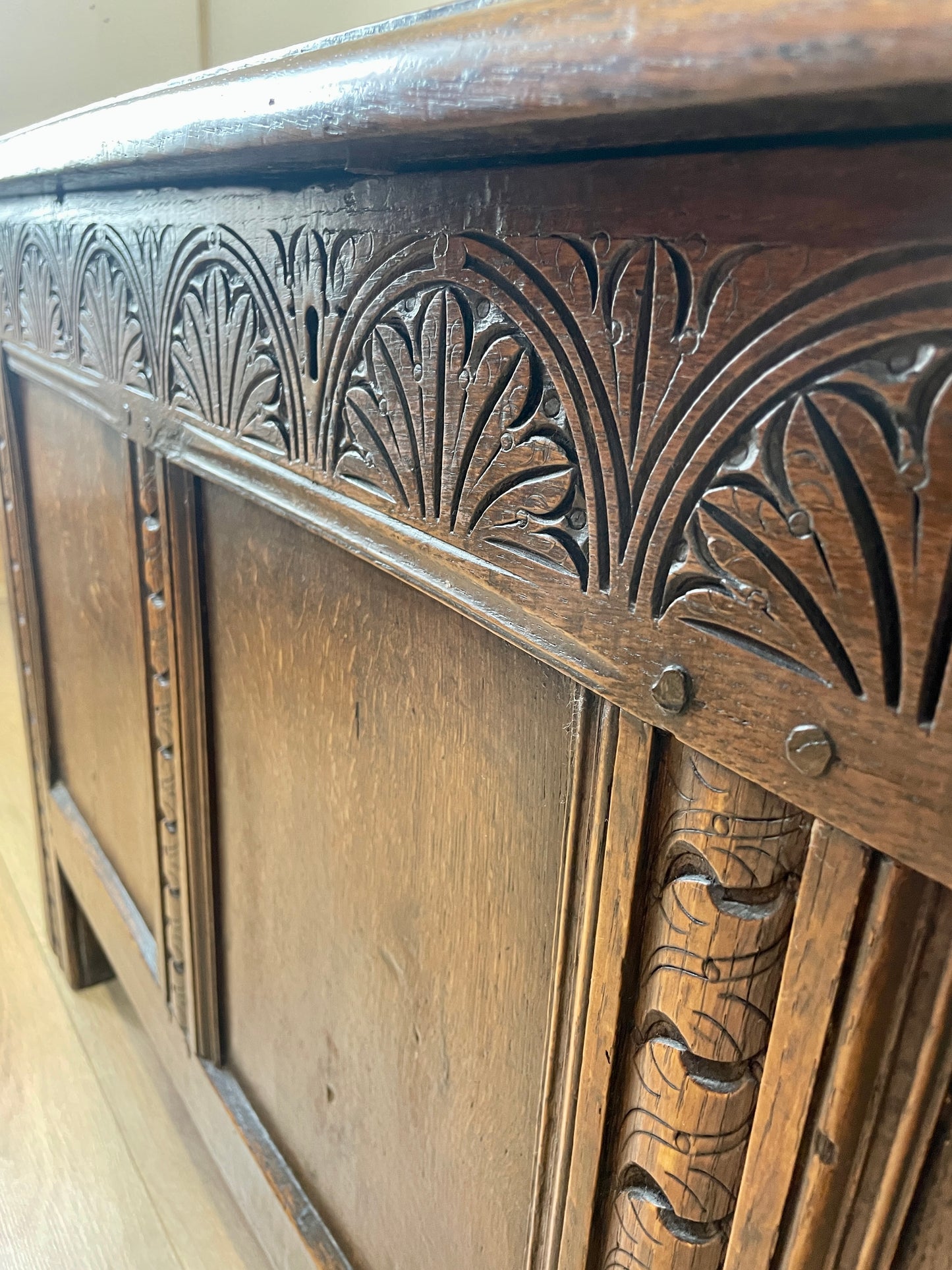 Close-up of a wooden cabinet with intricate carvings