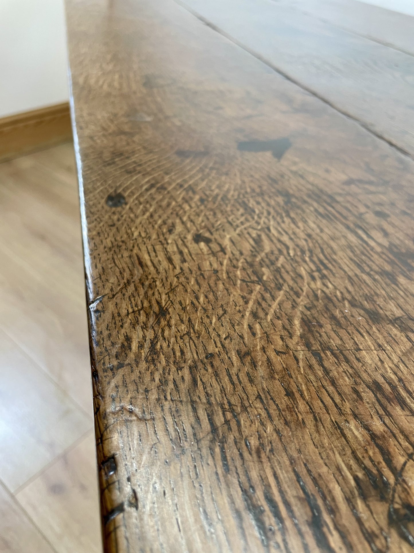 Close-up of a wooden surface with visible grain and texture