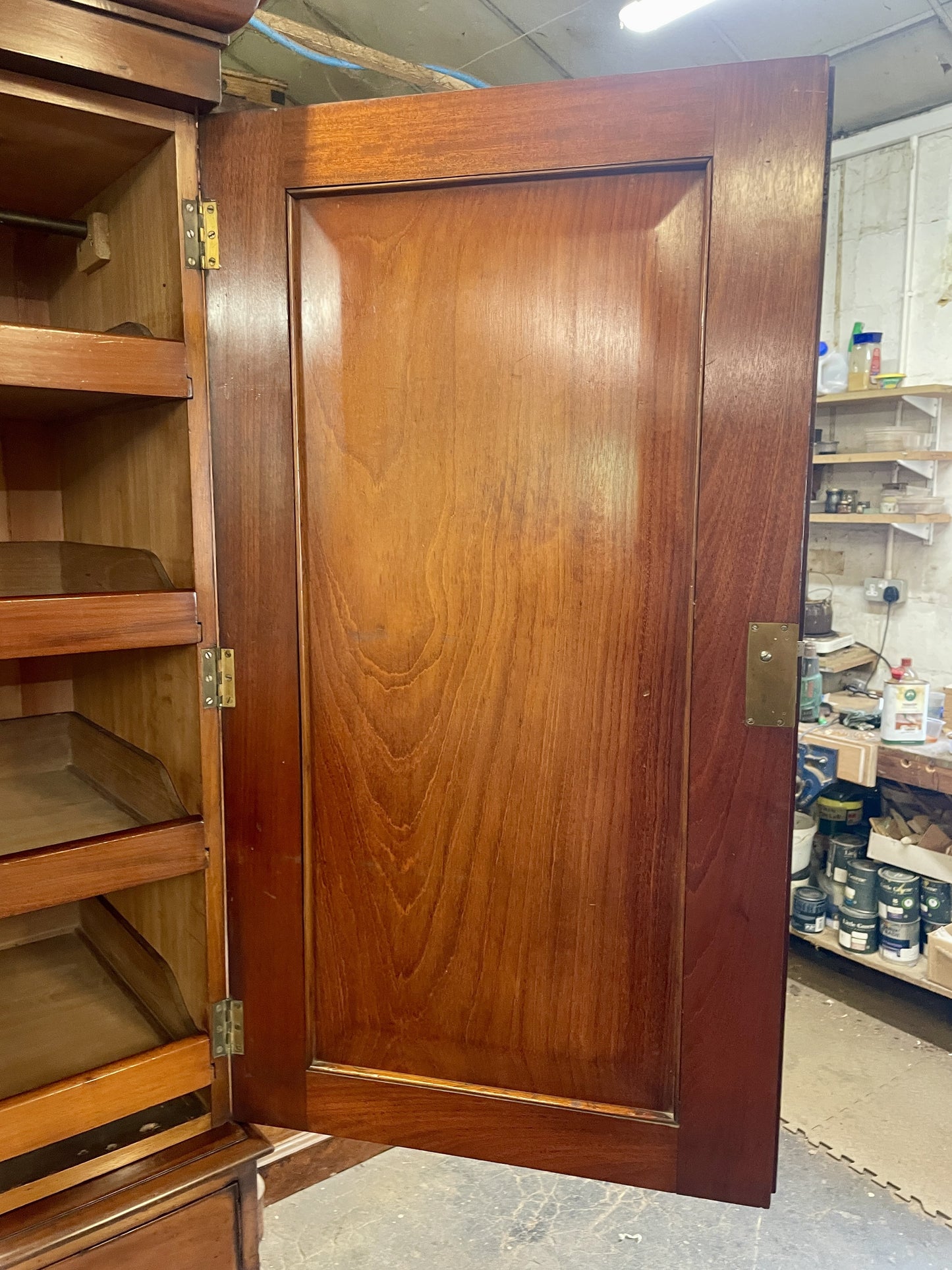 Wooden cabinet with a closed door in a storage room setting