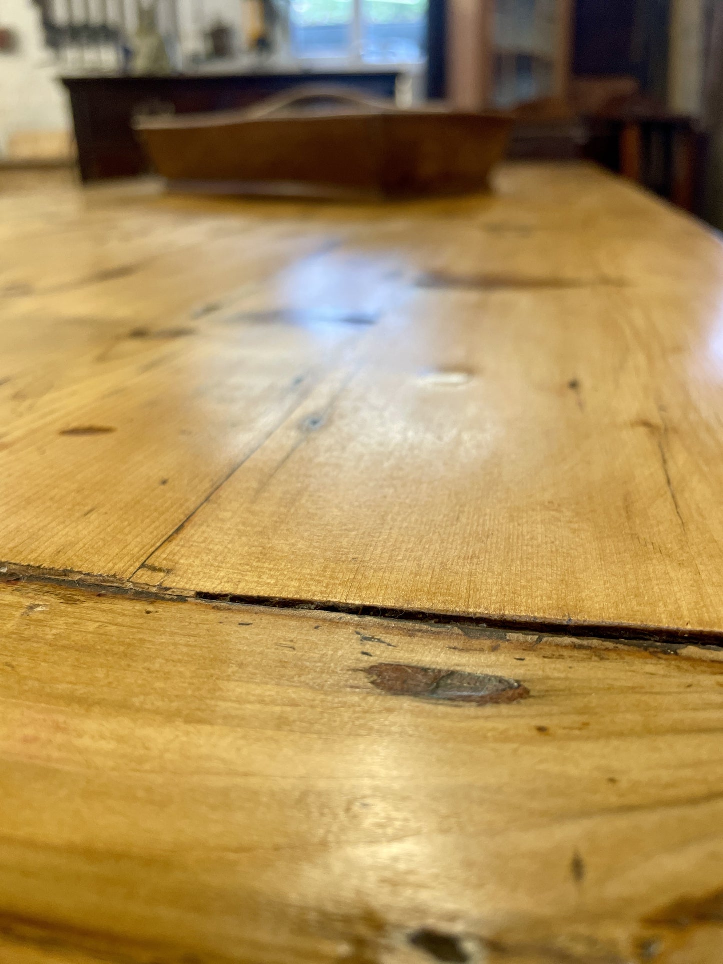 Close-up of a wooden table with visible grain and wear.