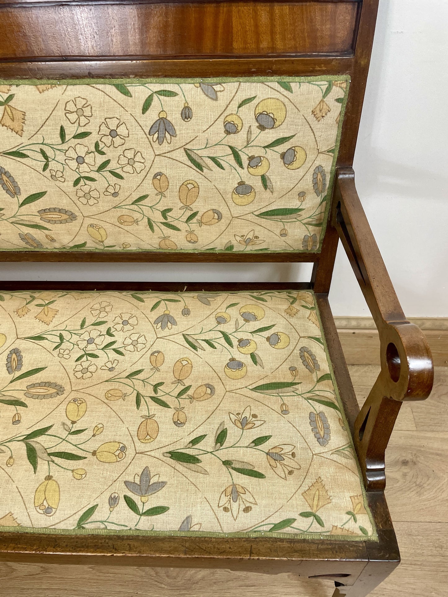 Chair with floral-patterned fabric on a wooden frame
