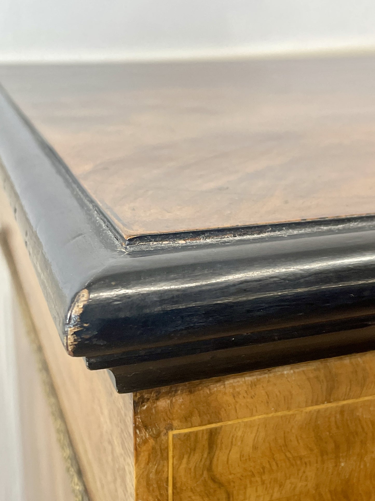 Close-up of a wooden surface with a black border