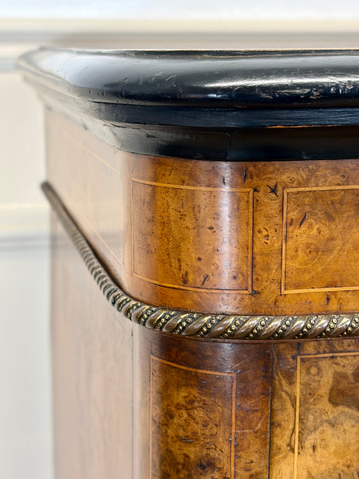 Close-up of a wooden pedestal with decorative elements