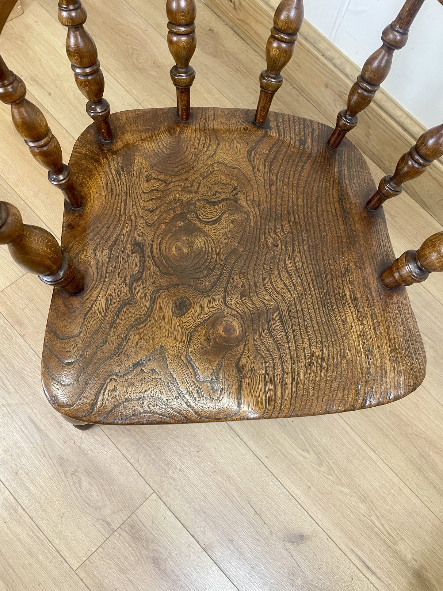 Wooden chair seat on a wooden floor