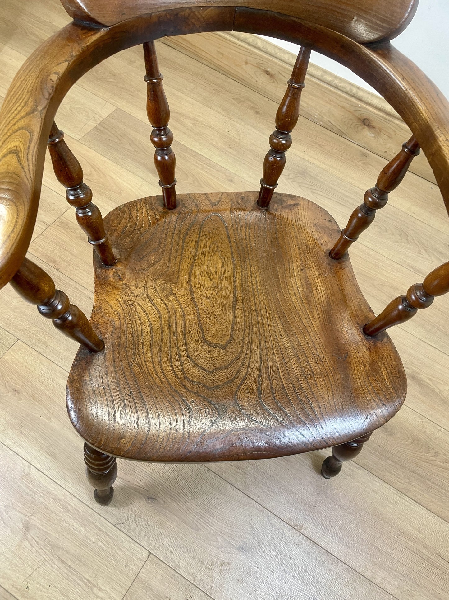 Wooden chair with turned legs on a wooden floor