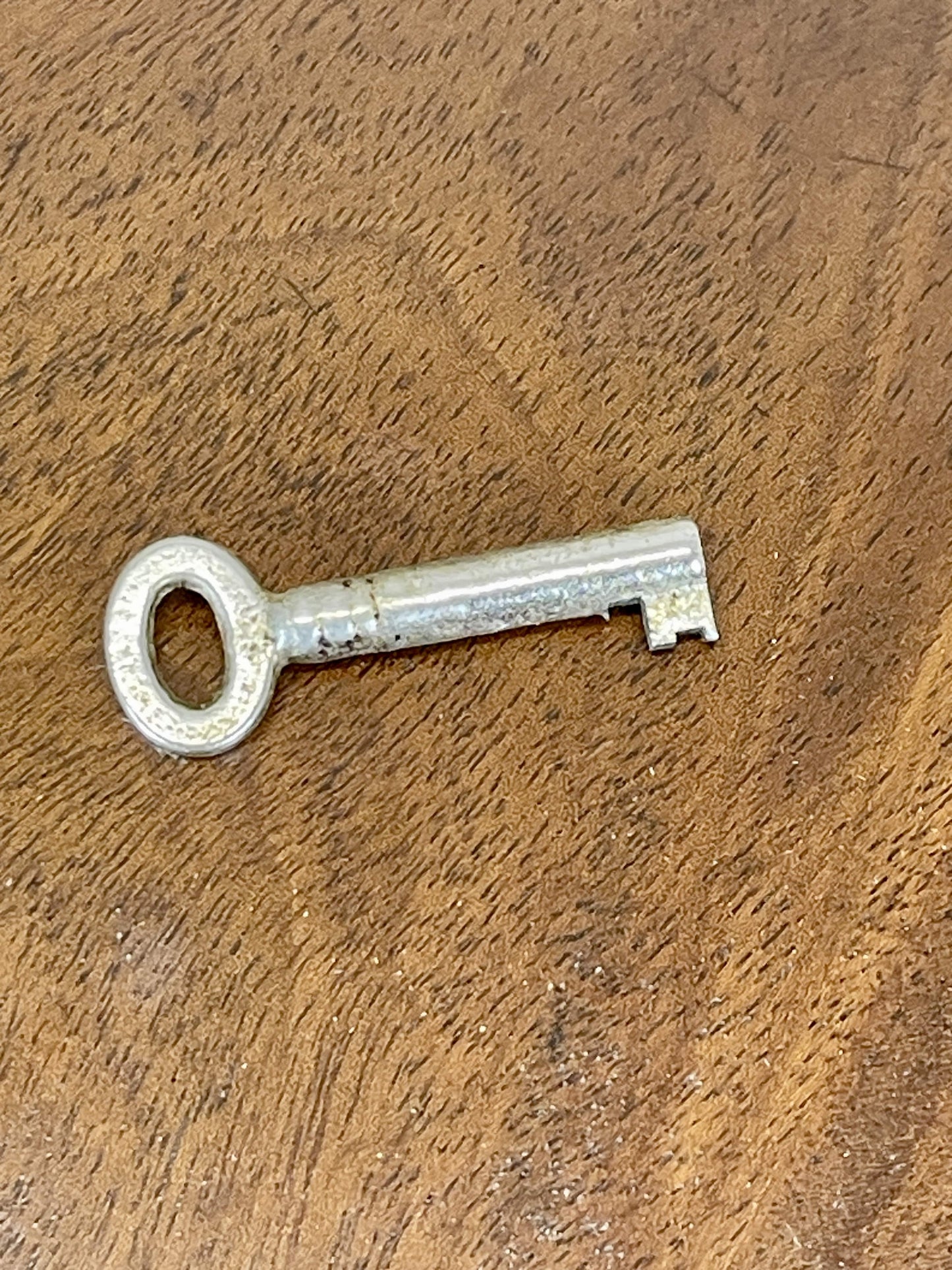 Vintage key on a wooden surface