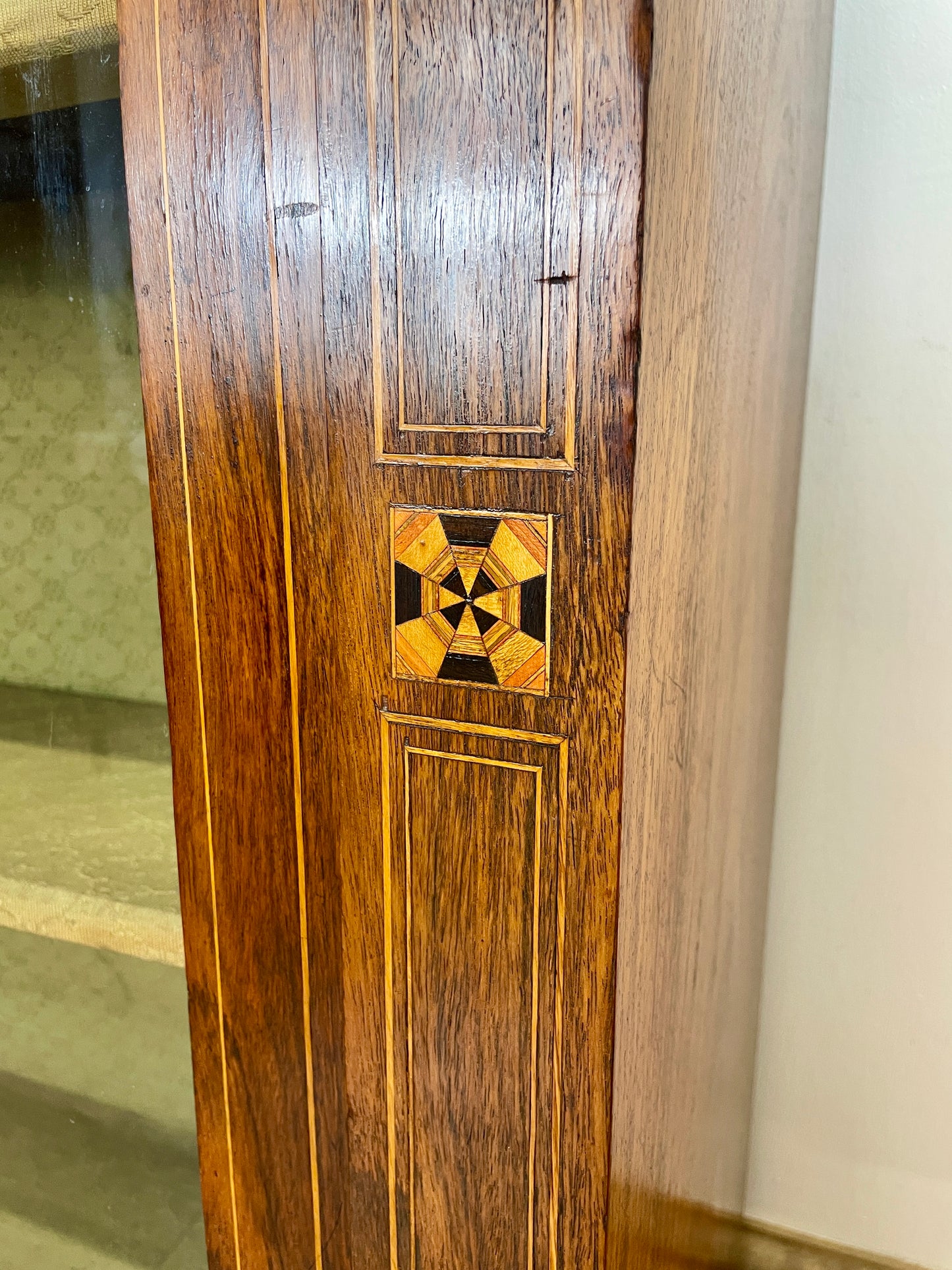 Wooden panel with geometric inlay design