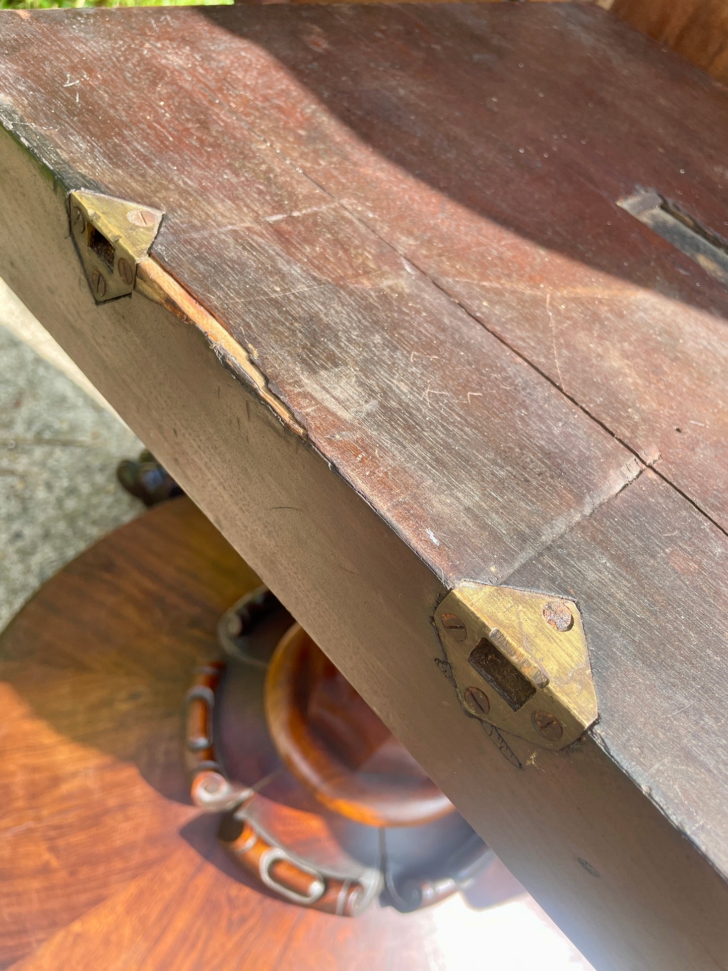 Wooden surface with a metal bracket and visible wear
