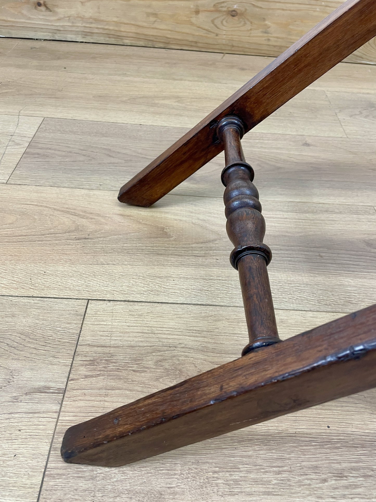 Wooden chair leg on a wooden floor