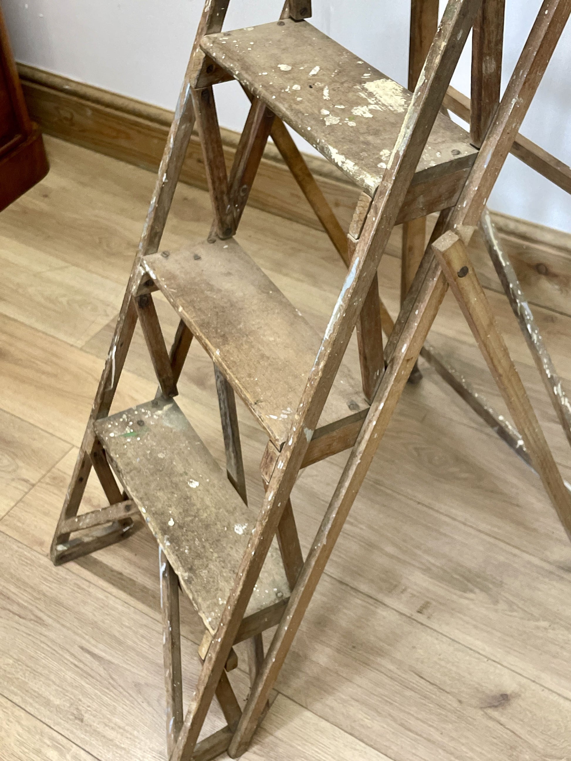 Wooden step ladder on a wooden floor