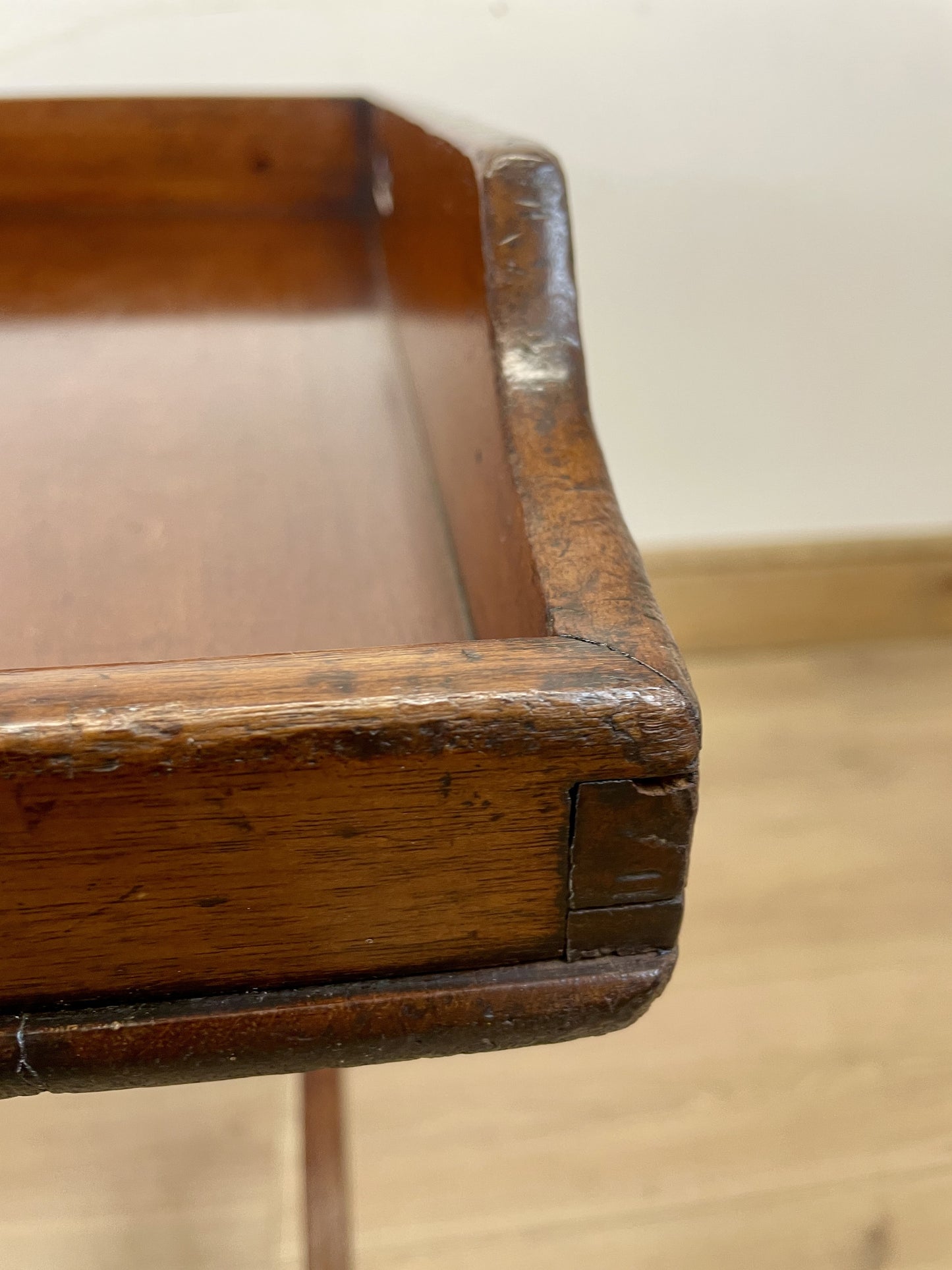 Close-up of a wooden chair with a plain background