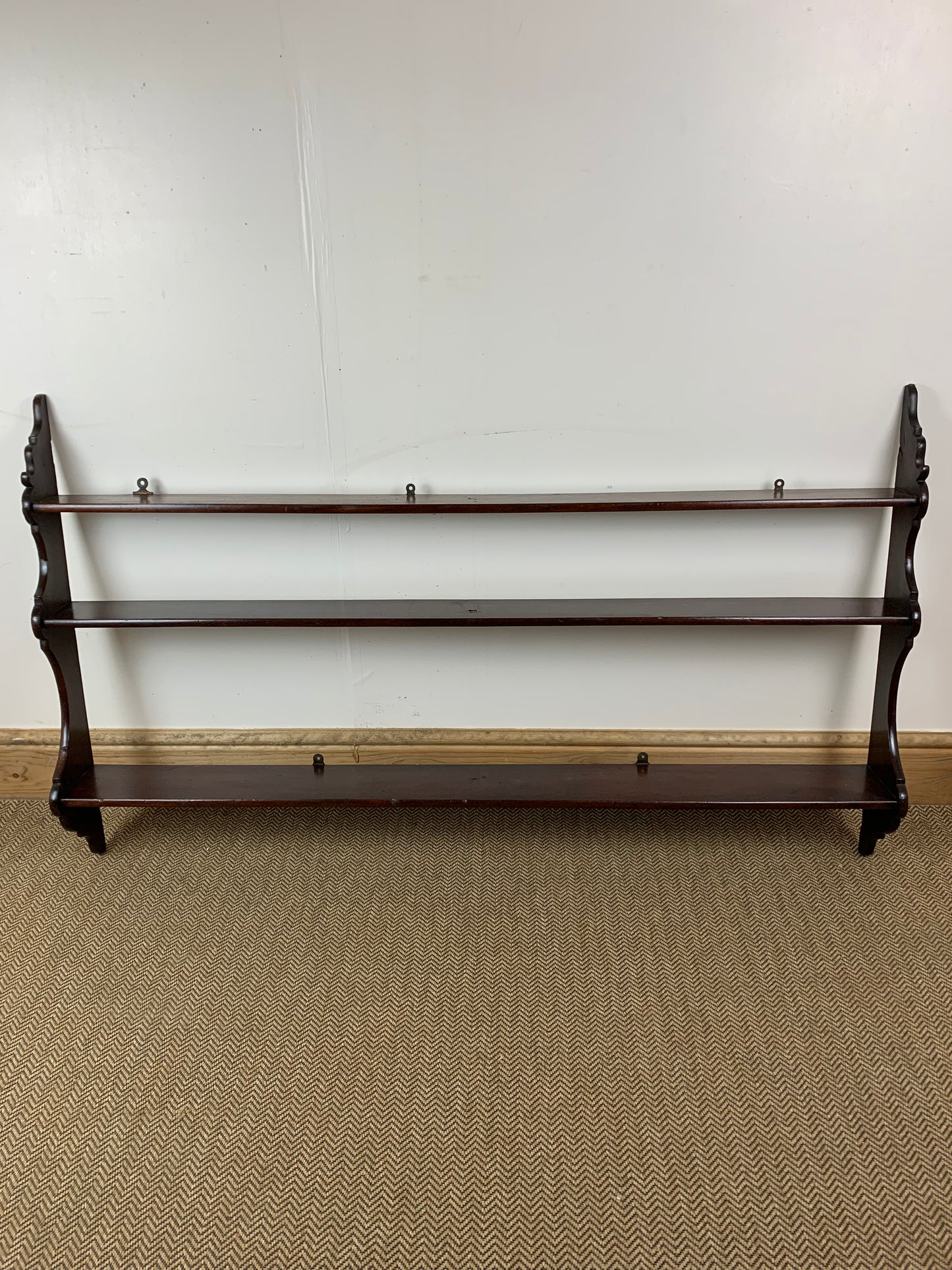 Victorian Mahogany Waterfall Shelves featuring a series of stepped shelves with a graceful cascading design, with a dark polished wood finish.