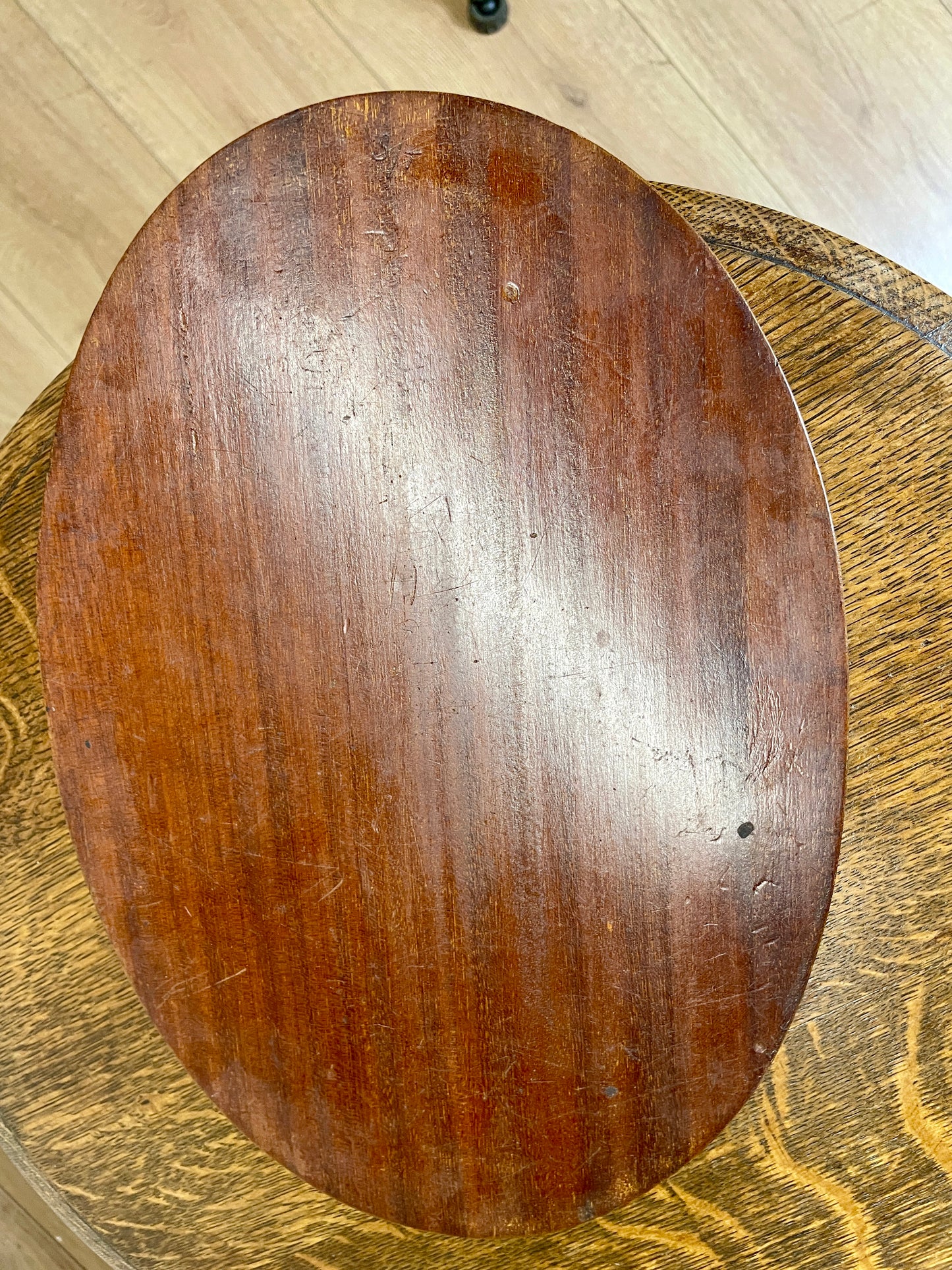 Wooden cutting board on a wooden surface