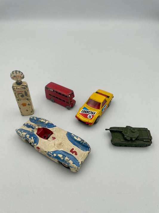Collection of vintage toy vehicles on a plain background