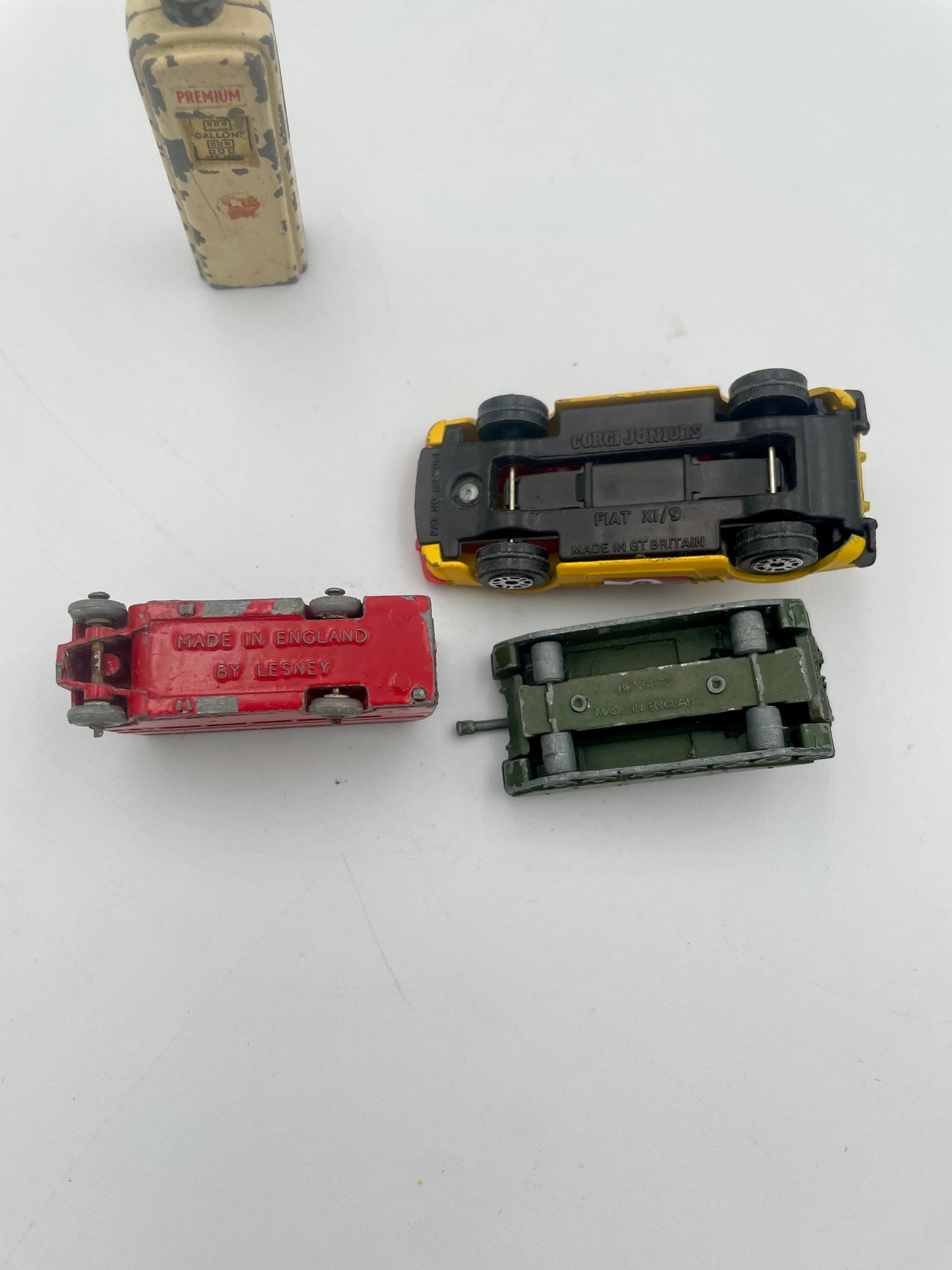 Four toy cars on a white background