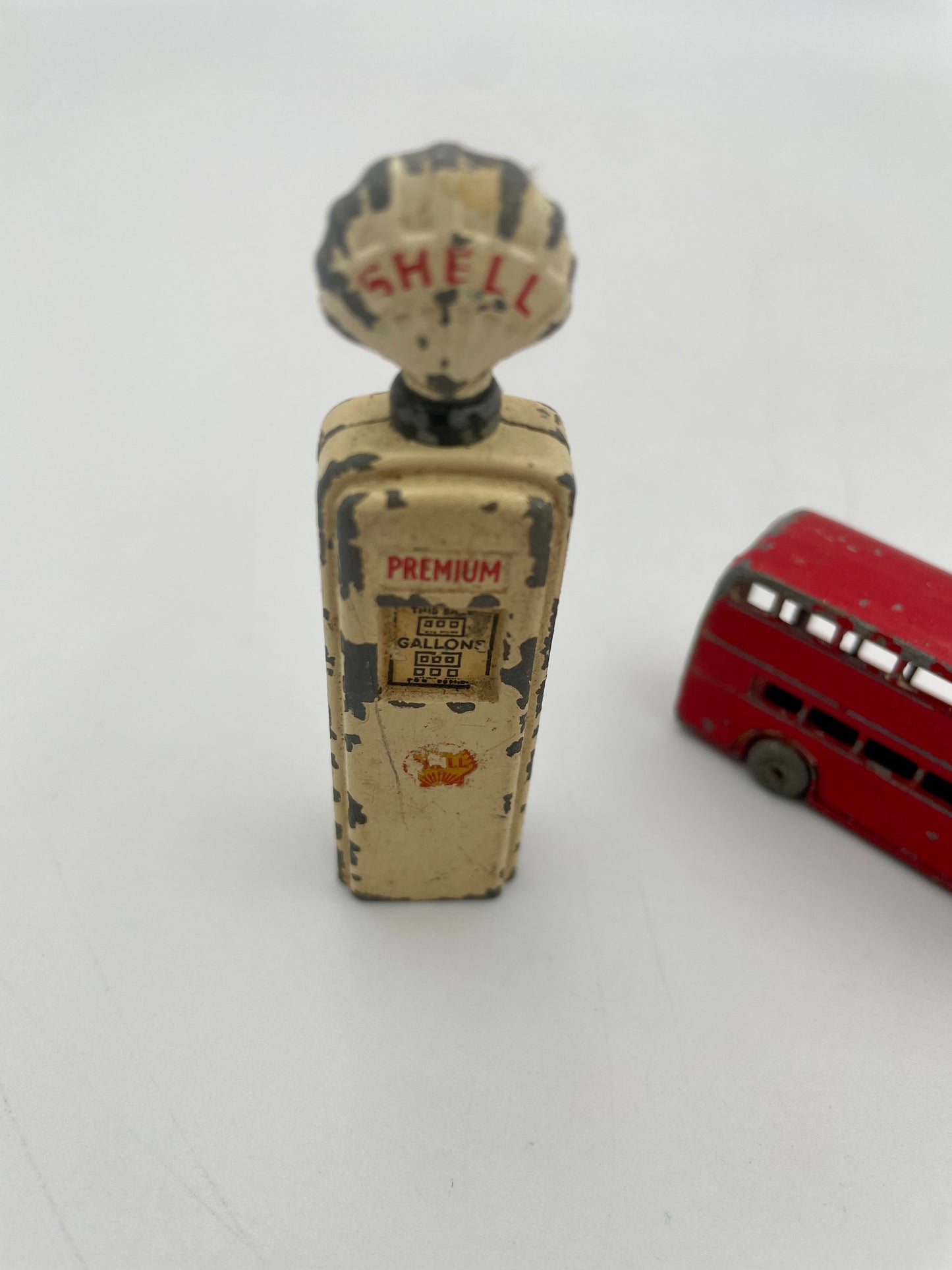 Model gas pump with 'Shell' branding on a white background