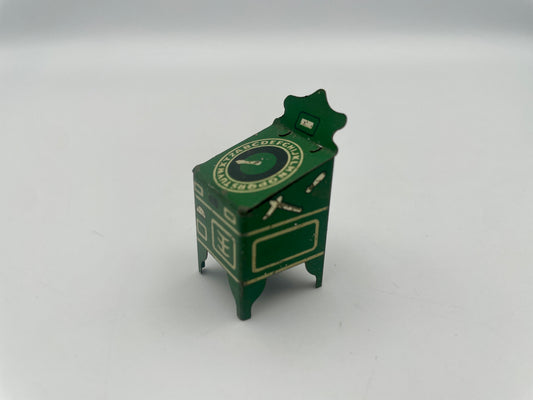 Green miniature dresser with decorative elements on a white background