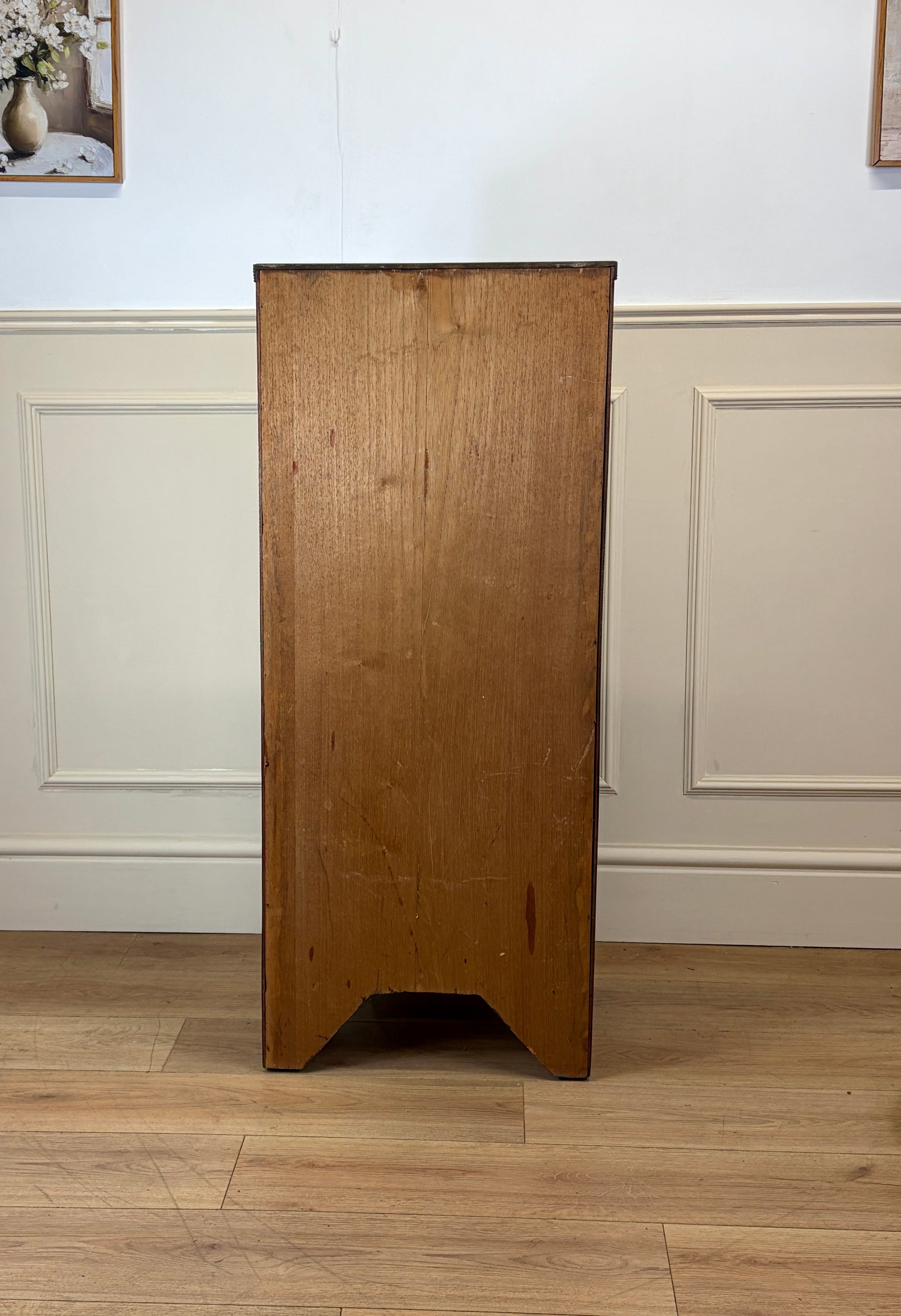 Front view of an antique Georgian mahogany small waterfall bookcase with two deep drawers