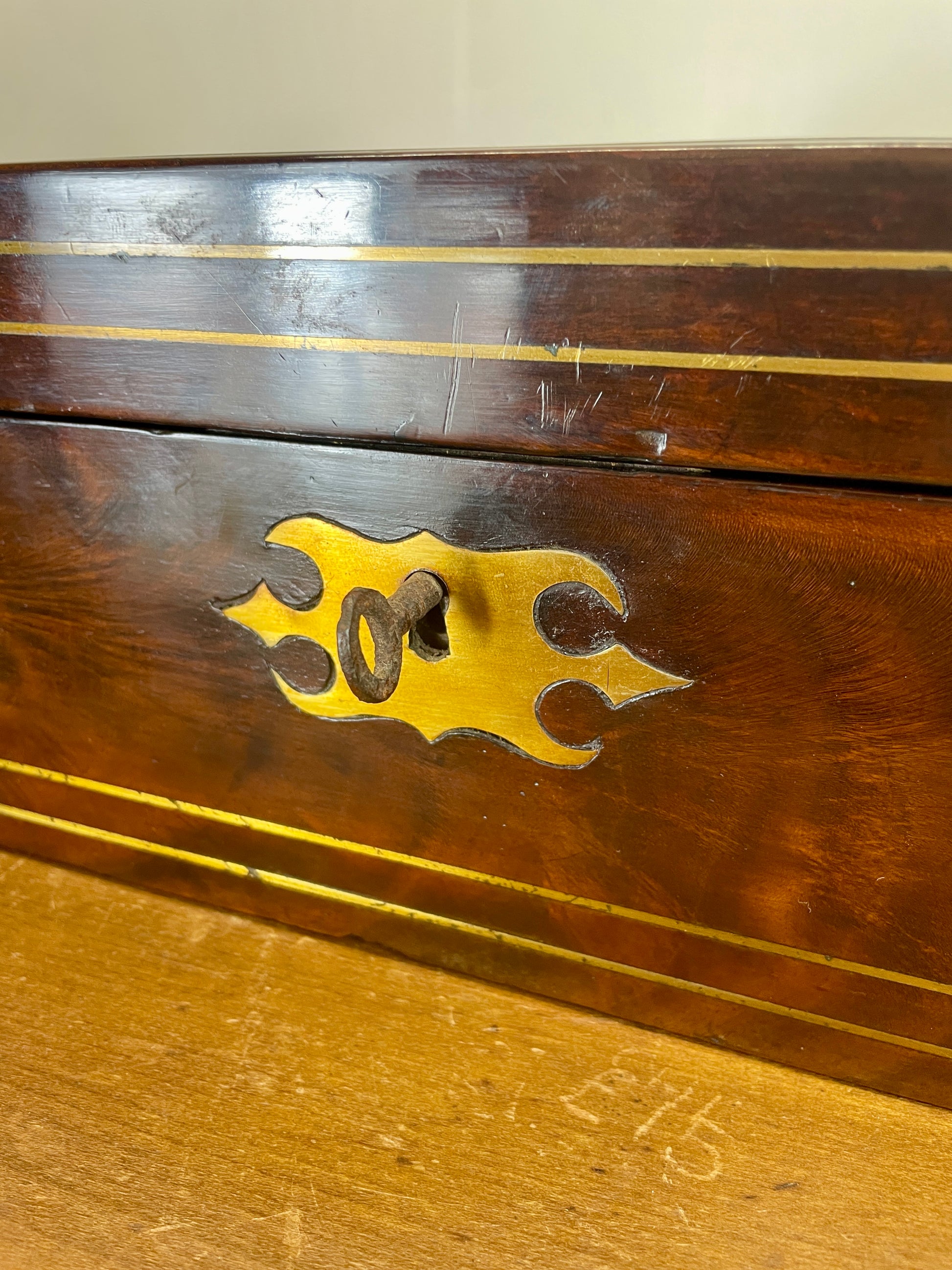 Wooden box with brass handle and decorative elements