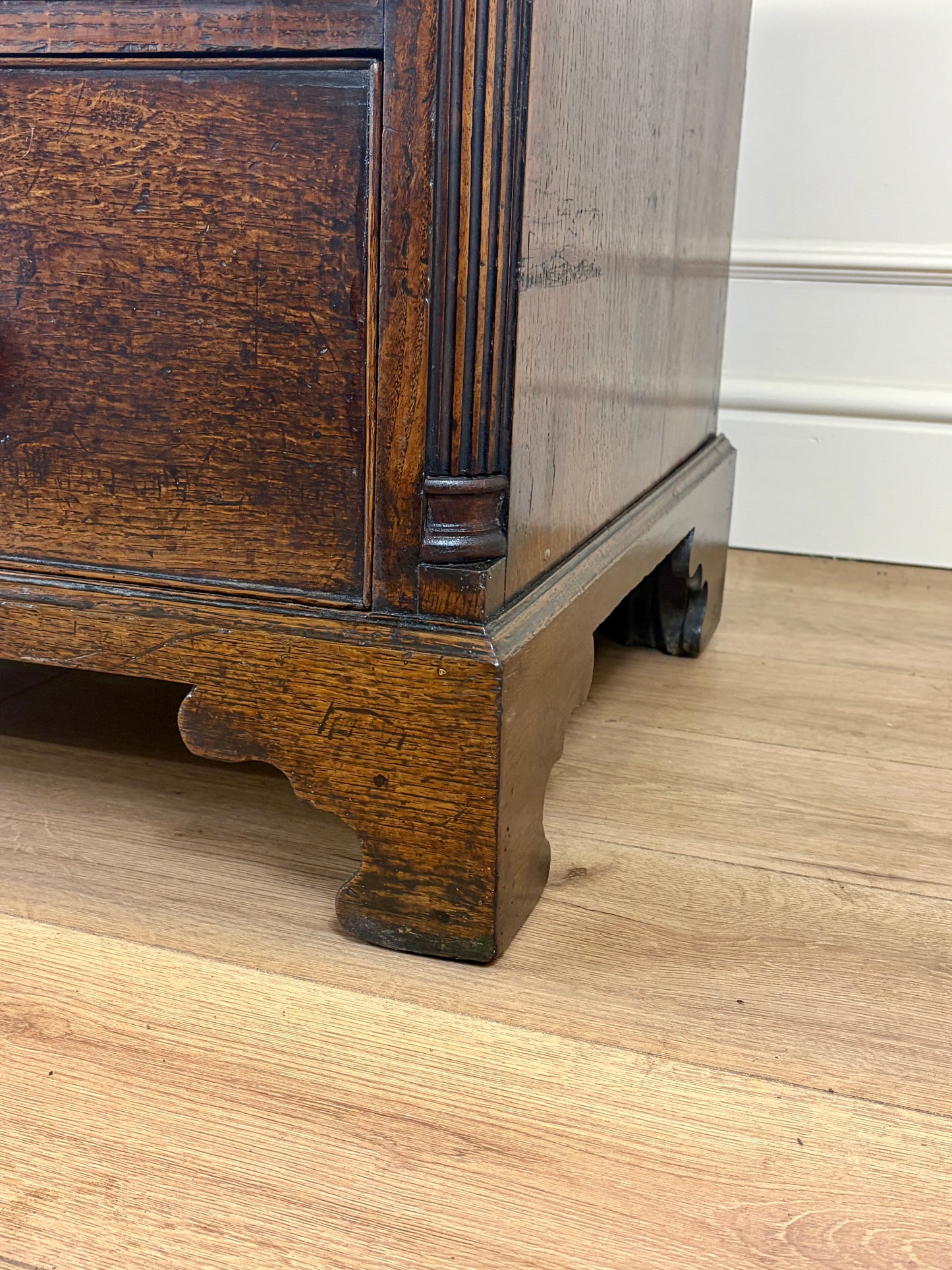 antique georgian oak chest of drawers with carved detail