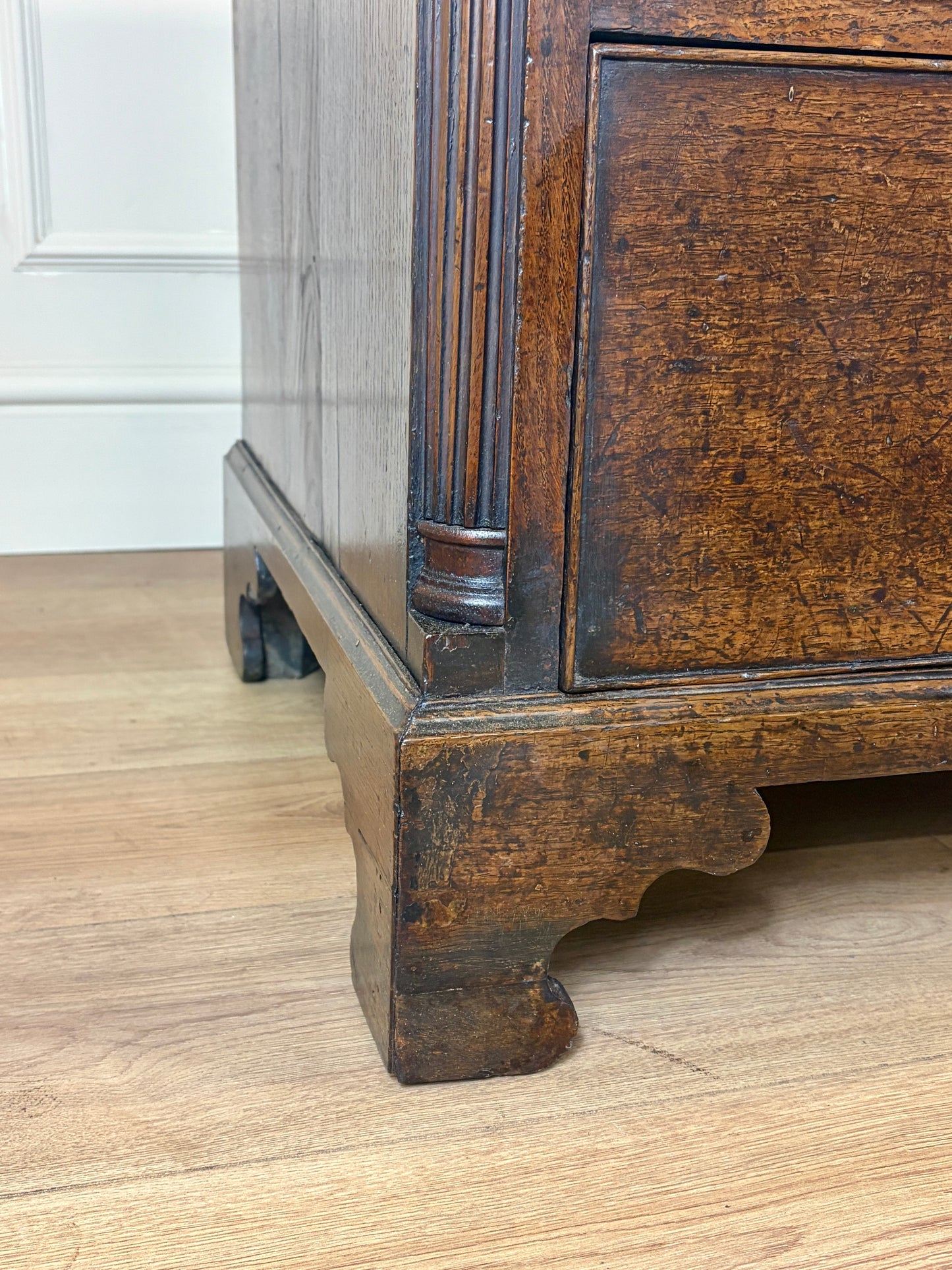 antique georgian oak chest of drawers with carved detail