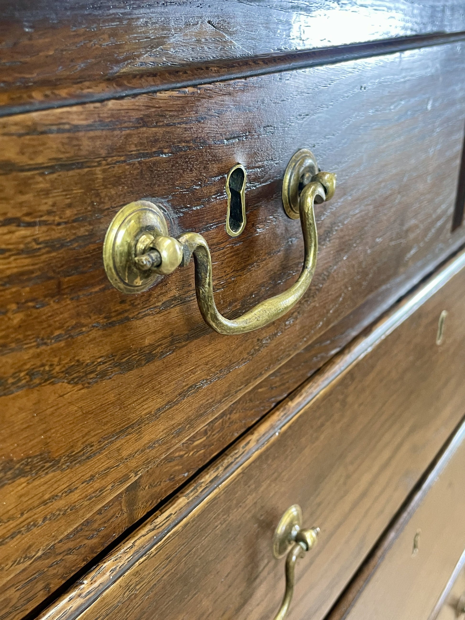 Antique Georgian oak chest of drawers with original brass handles