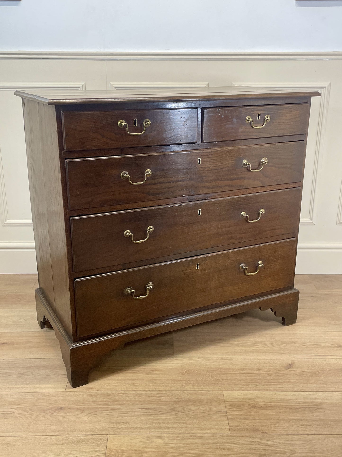 Antique Georgian oak chest of drawers with original brass handles