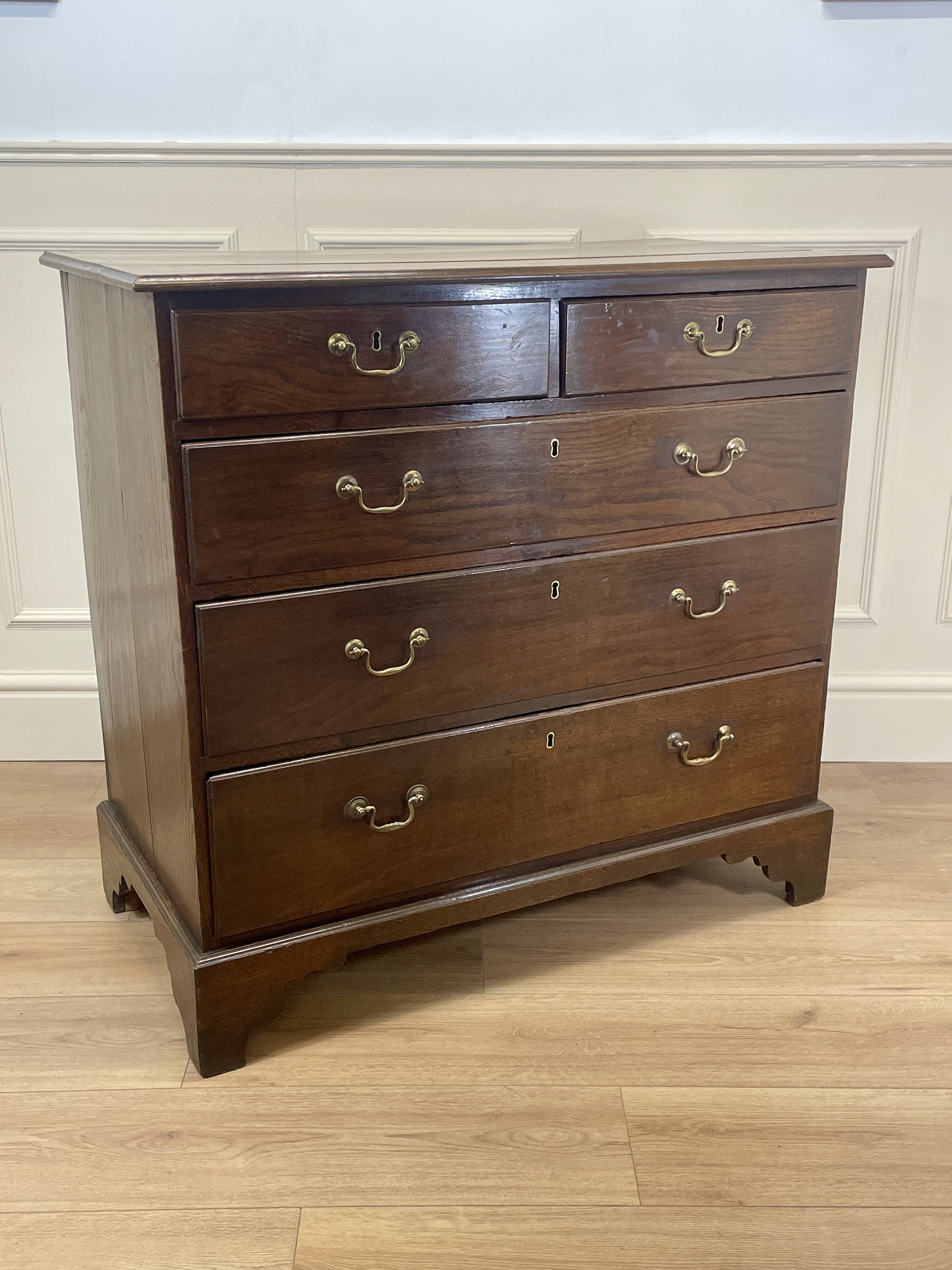 Antique Georgian oak chest of drawers with original brass handles