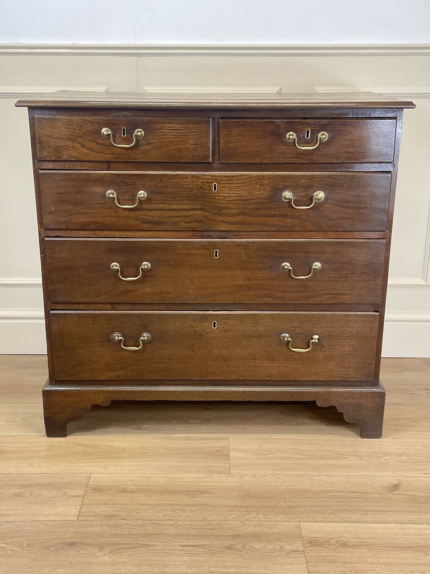 Antique Georgian oak chest of drawers with original brass handles