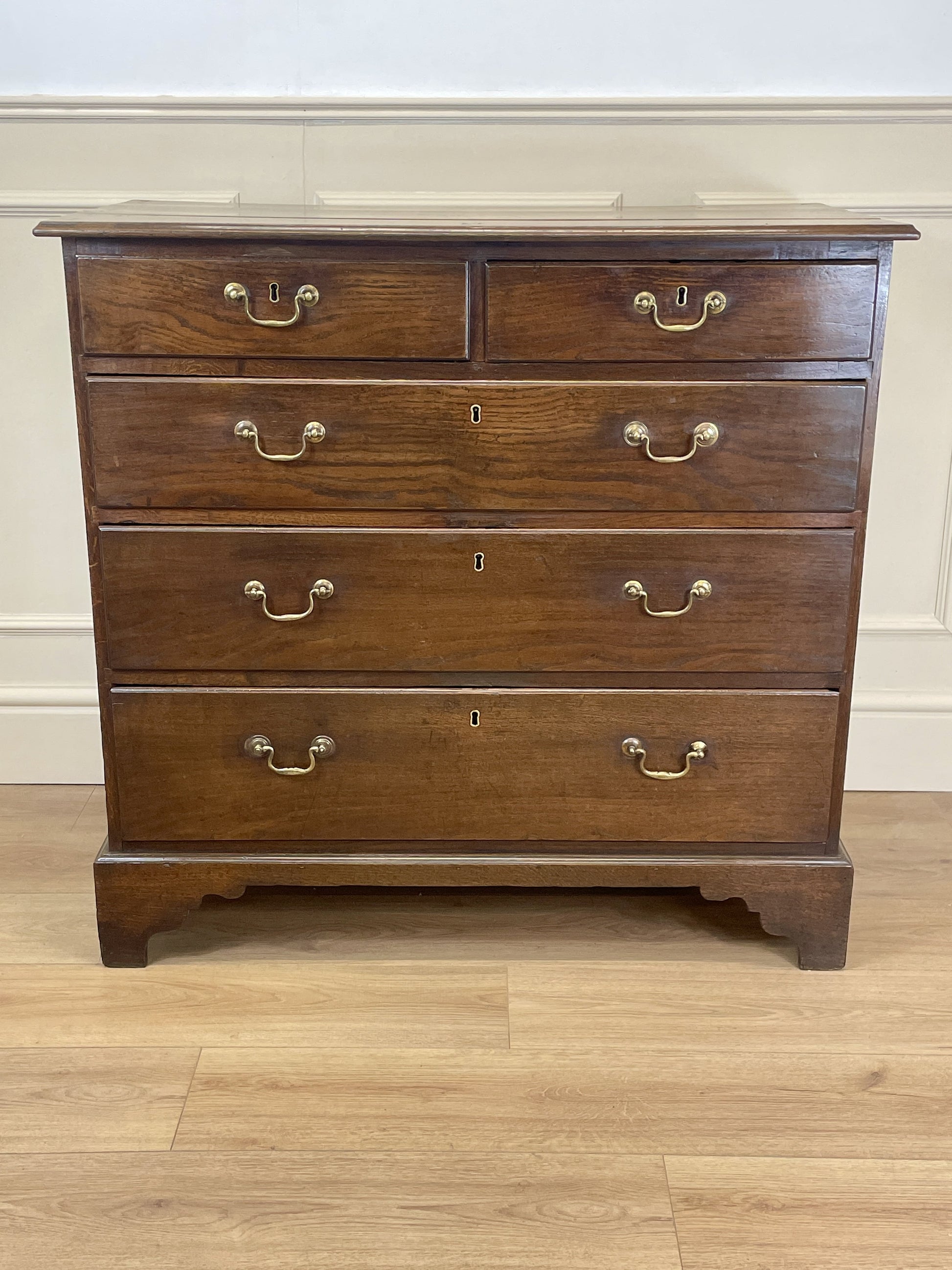 Antique Georgian oak chest of drawers with original brass handles