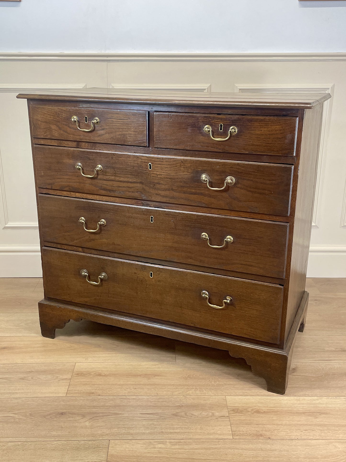 Antique Georgian oak chest of drawers with original brass handles