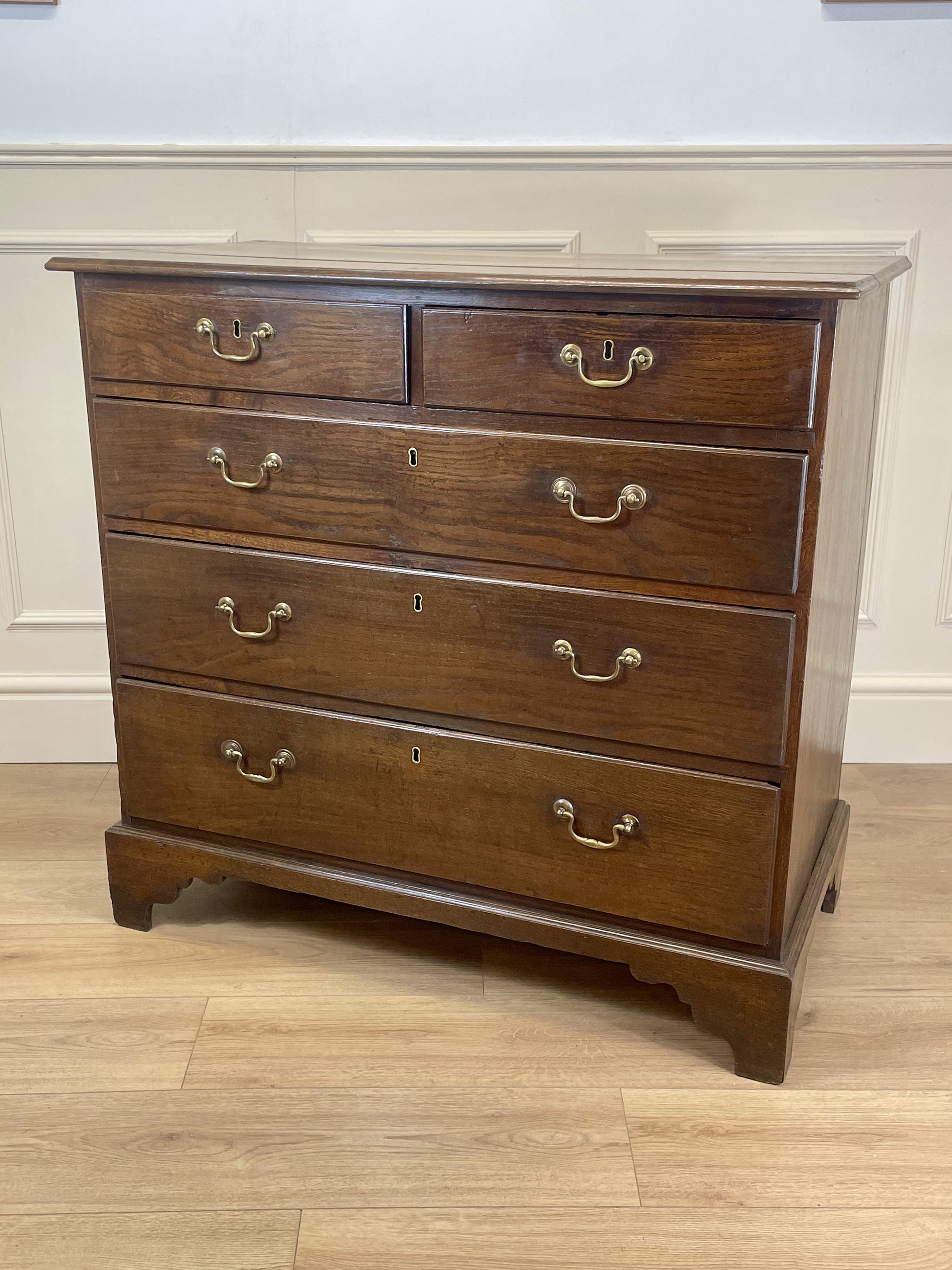 Antique Georgian oak chest of drawers with original brass handles