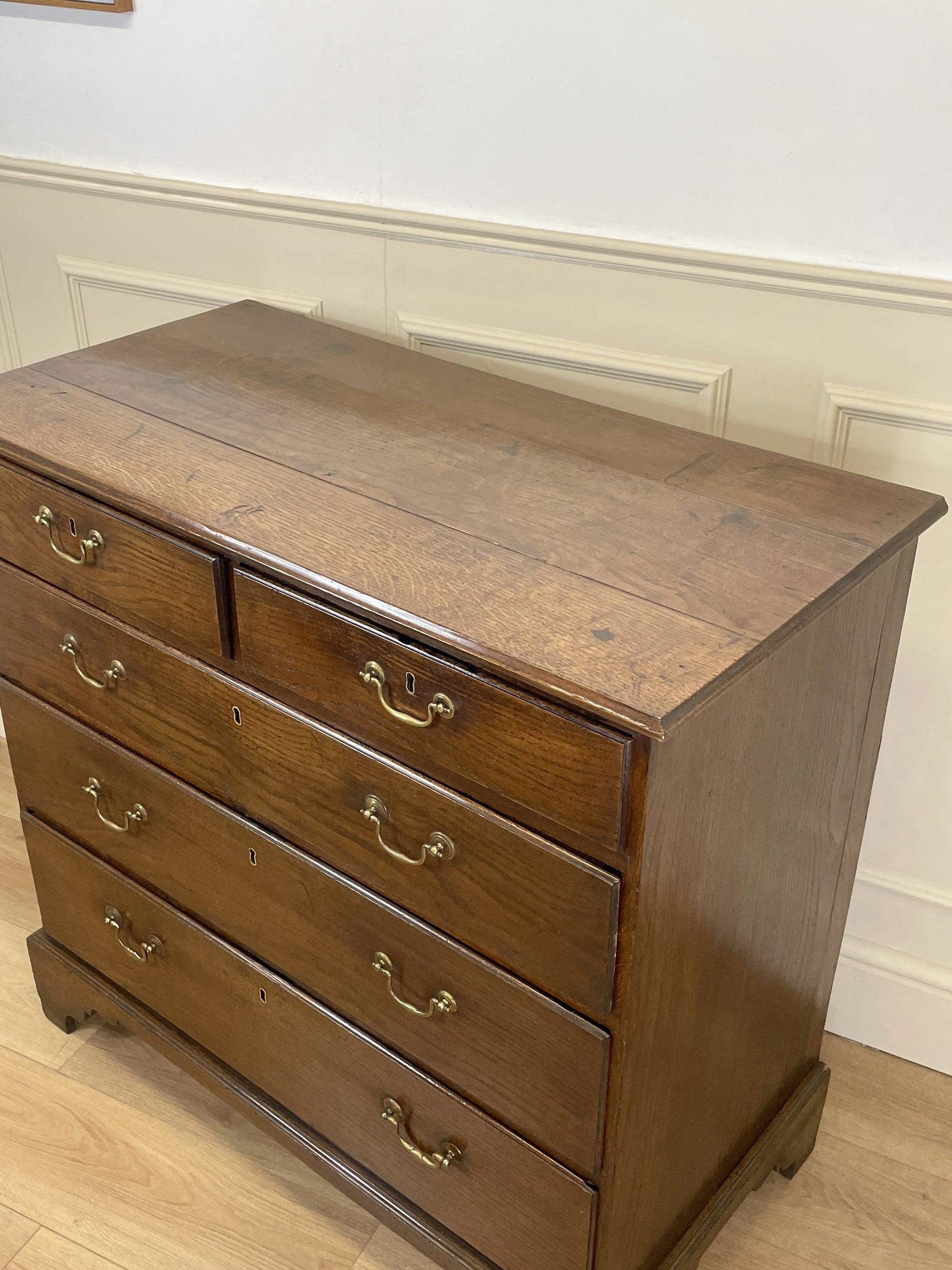 Antique Georgian oak chest of drawers with original brass handles