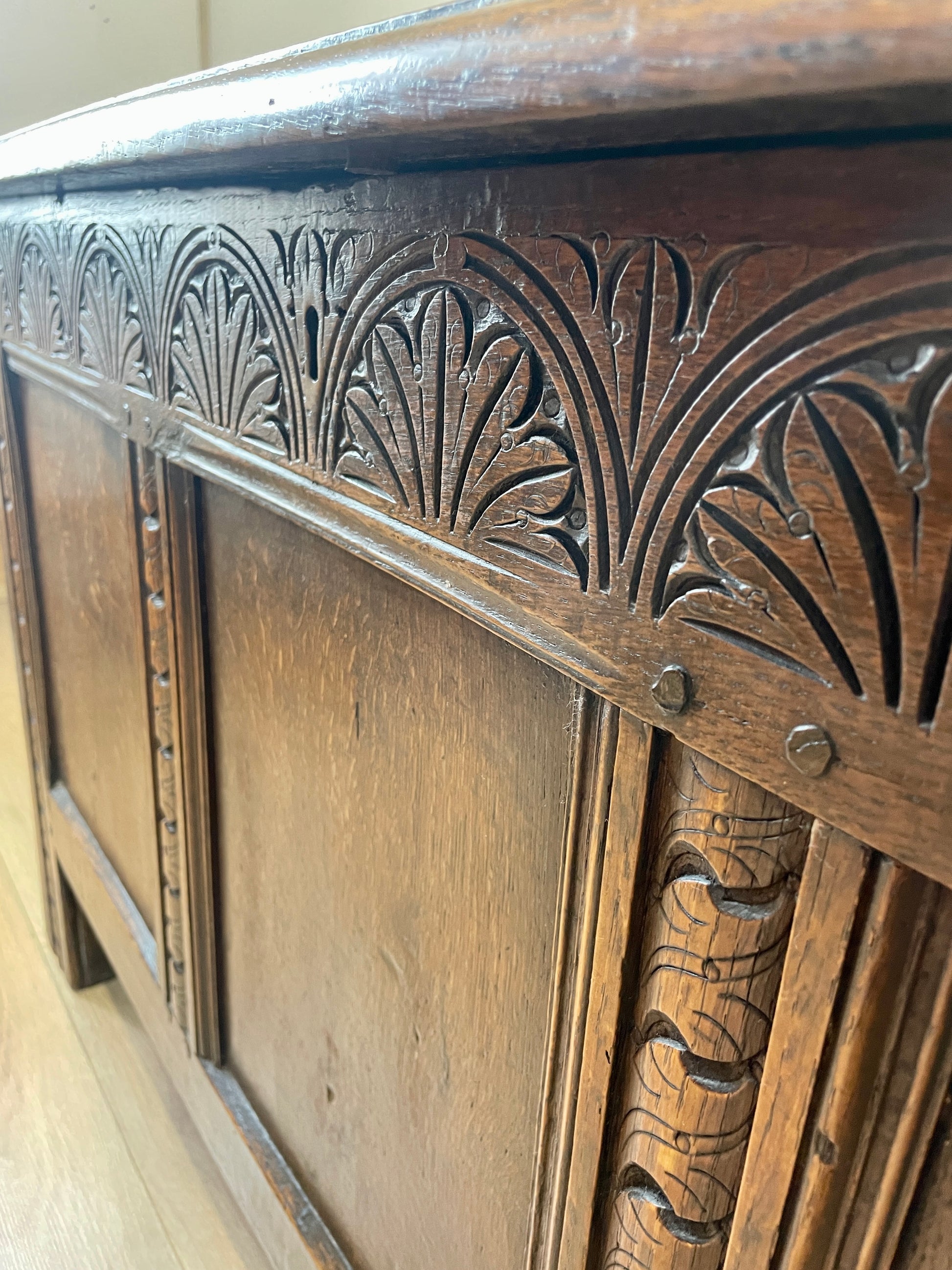Close-up of a wooden cabinet with intricate carvings