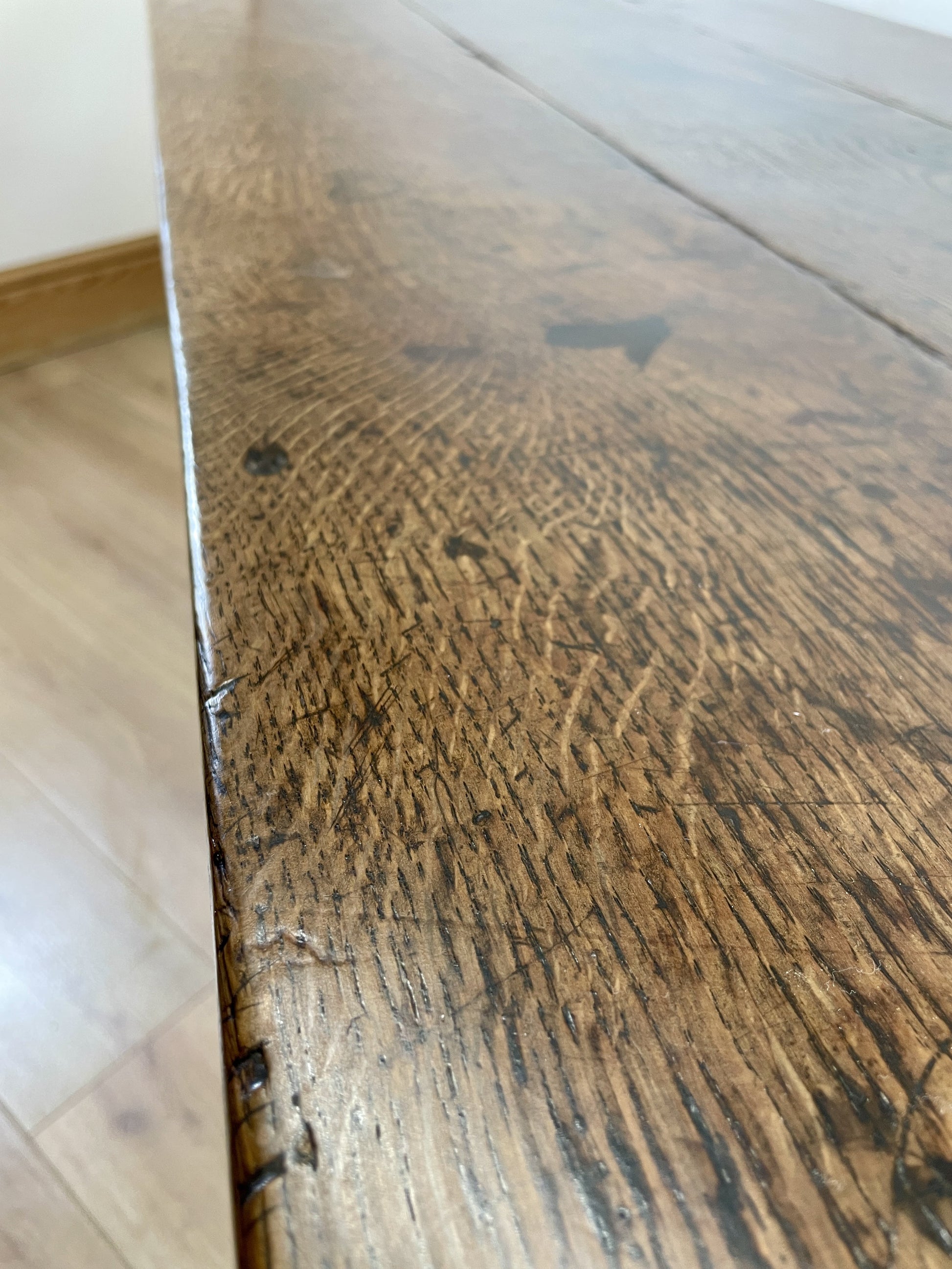 Close-up of a wooden surface with visible grain and texture