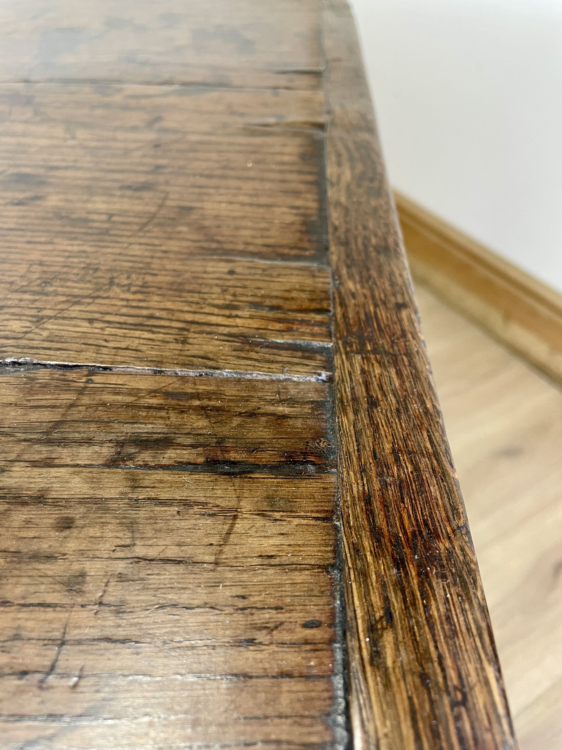 Close-up of a wooden surface with visible grain and wear