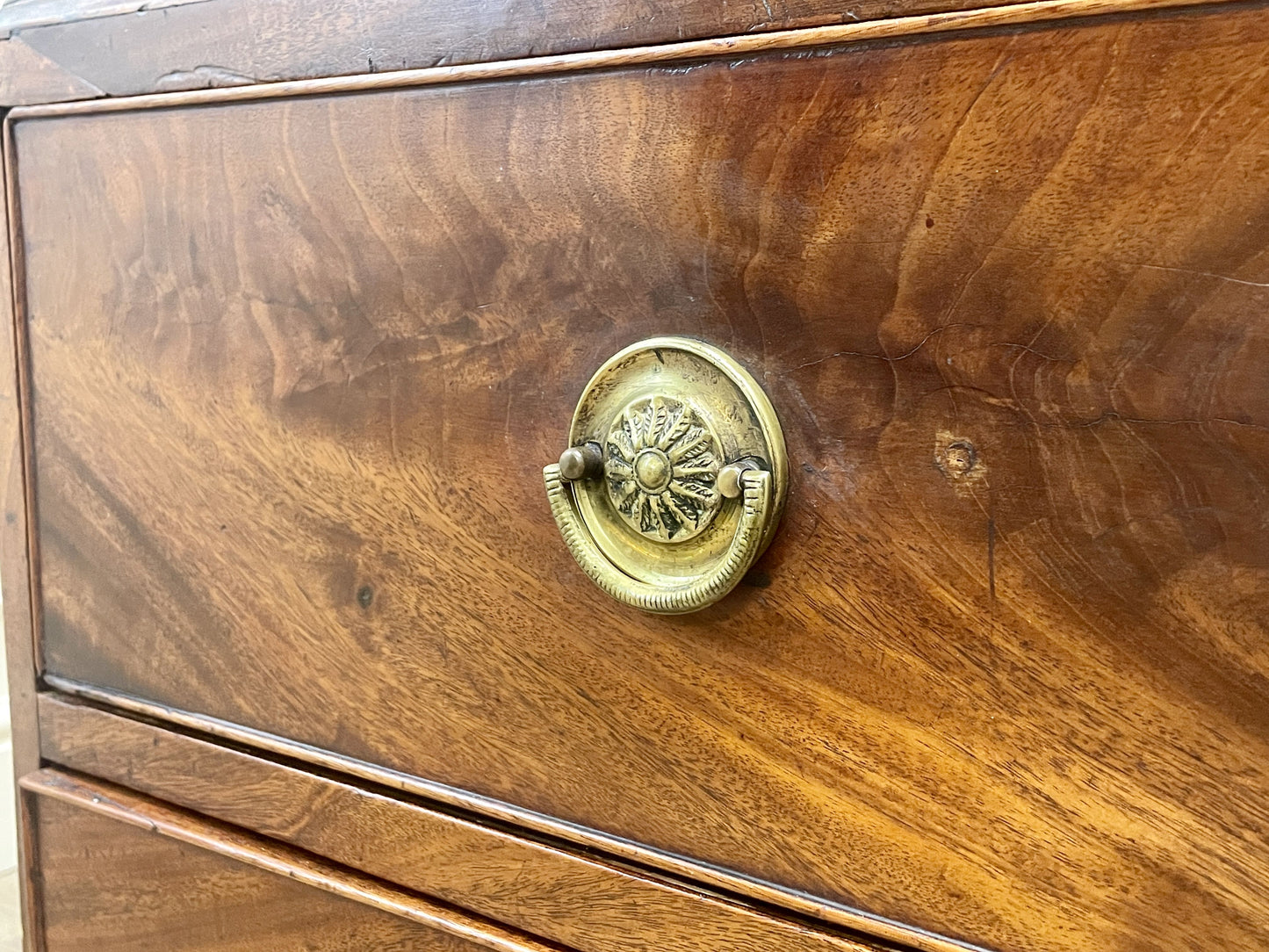 Wooden drawer with a brass handle