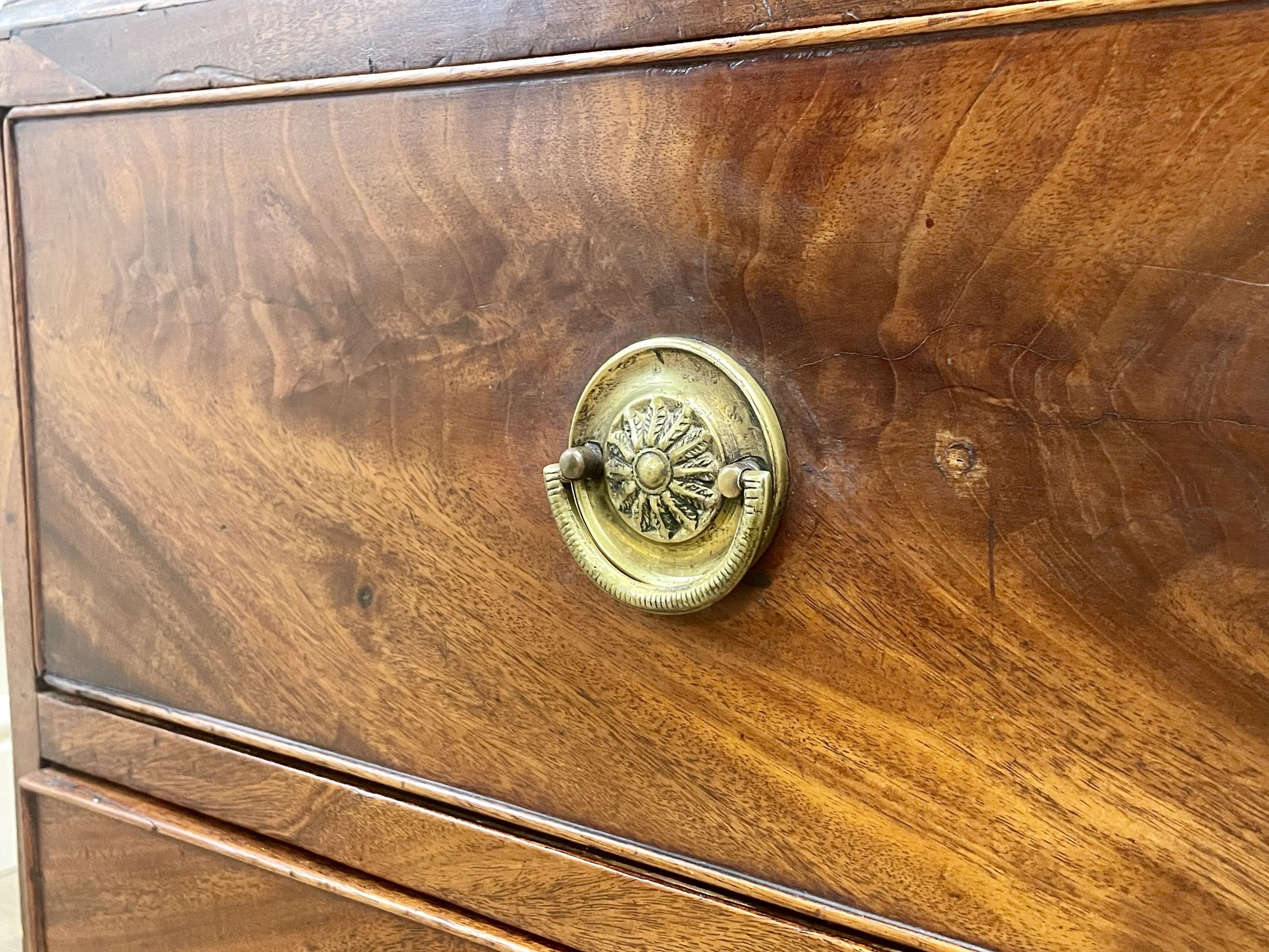 Wooden drawer with a brass handle