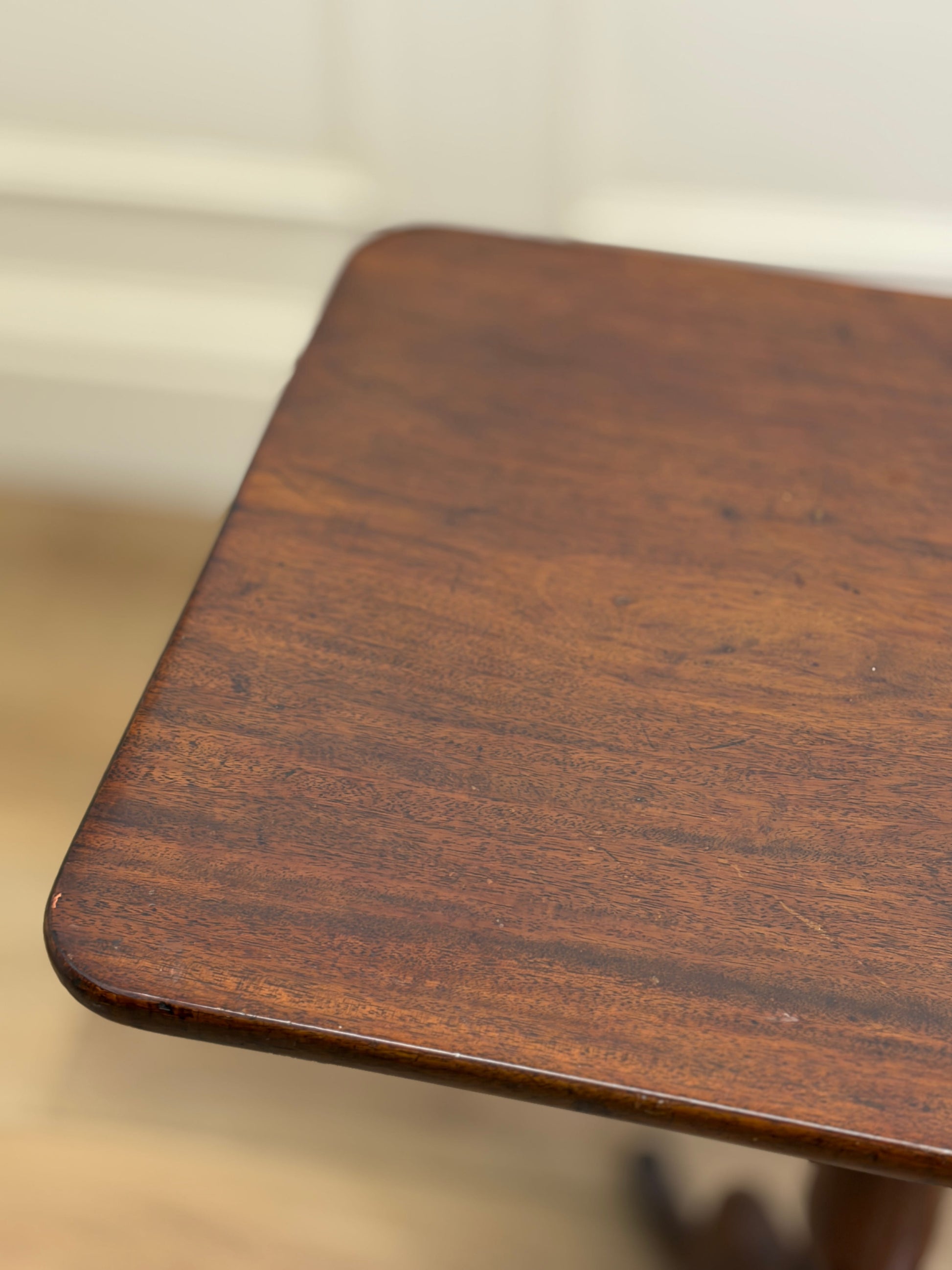 Close-up of a wooden surface with a blurred background