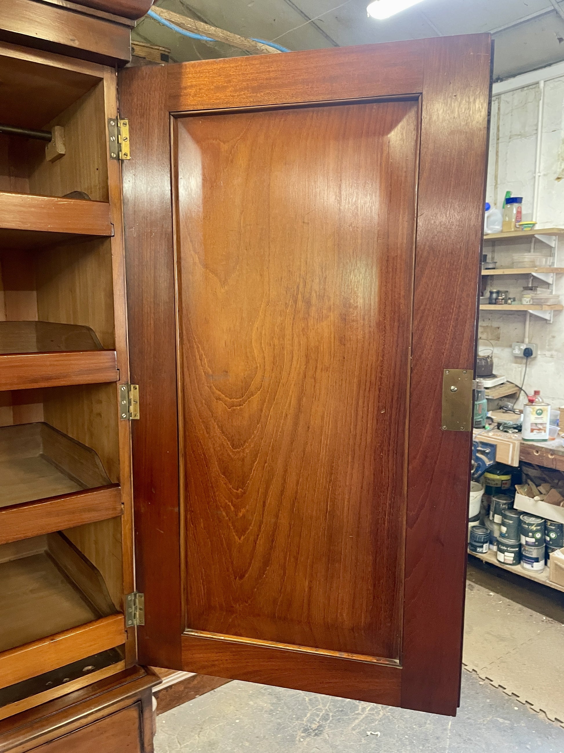 Wooden cabinet with a closed door in a storage room setting